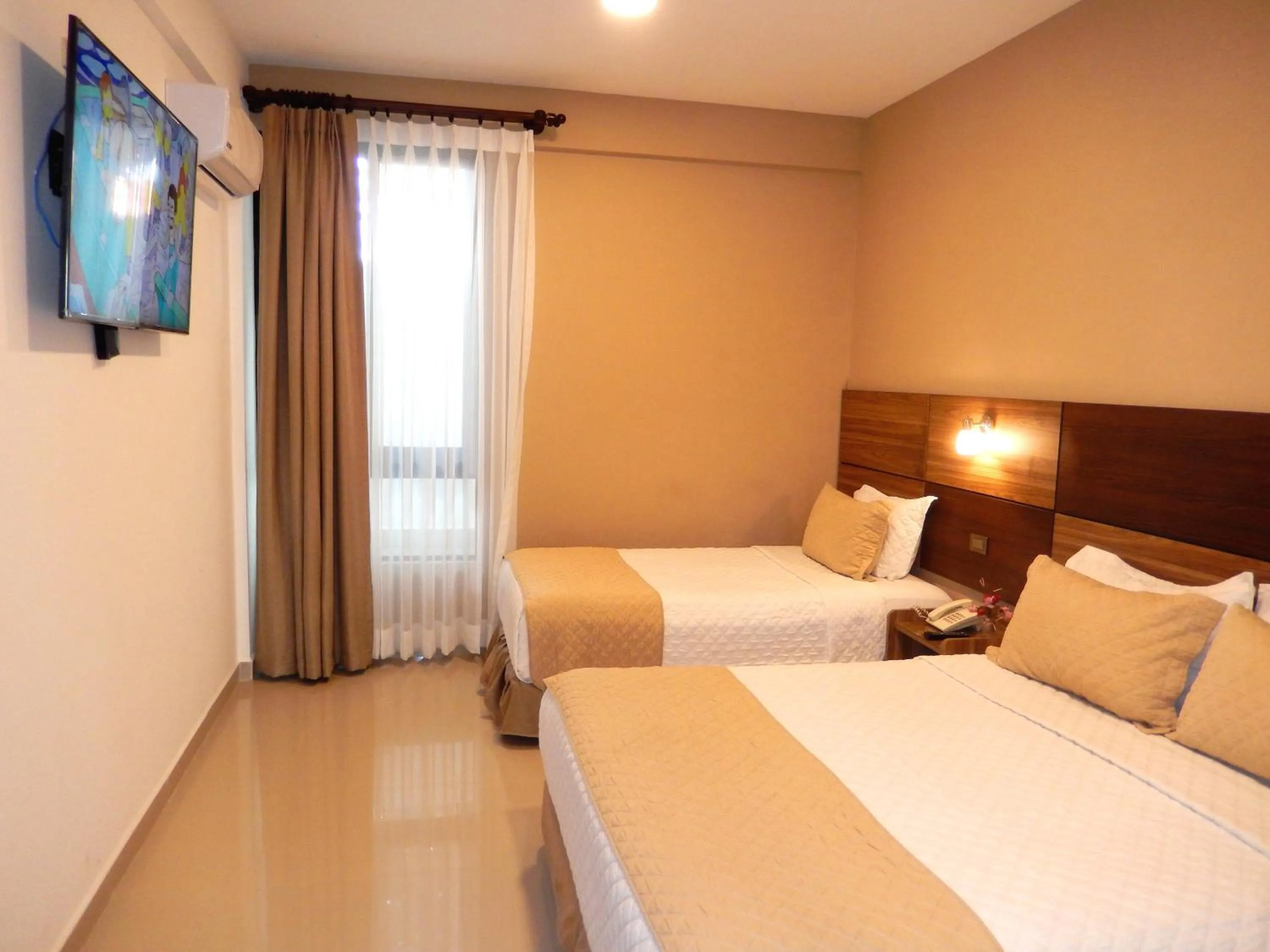 Bed in Premium Suites Deluxe Aparthotel Equipetrol