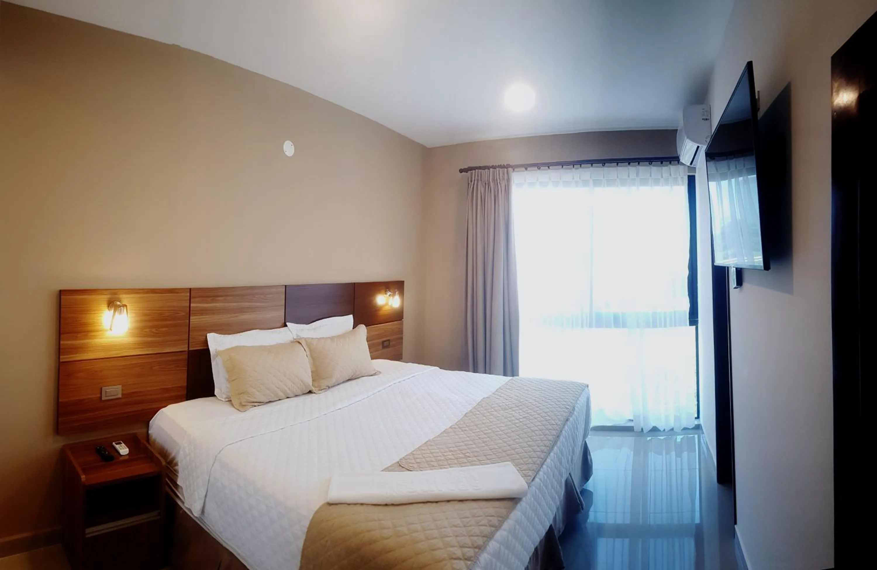 Bed in Premium Suites Deluxe Aparthotel Equipetrol