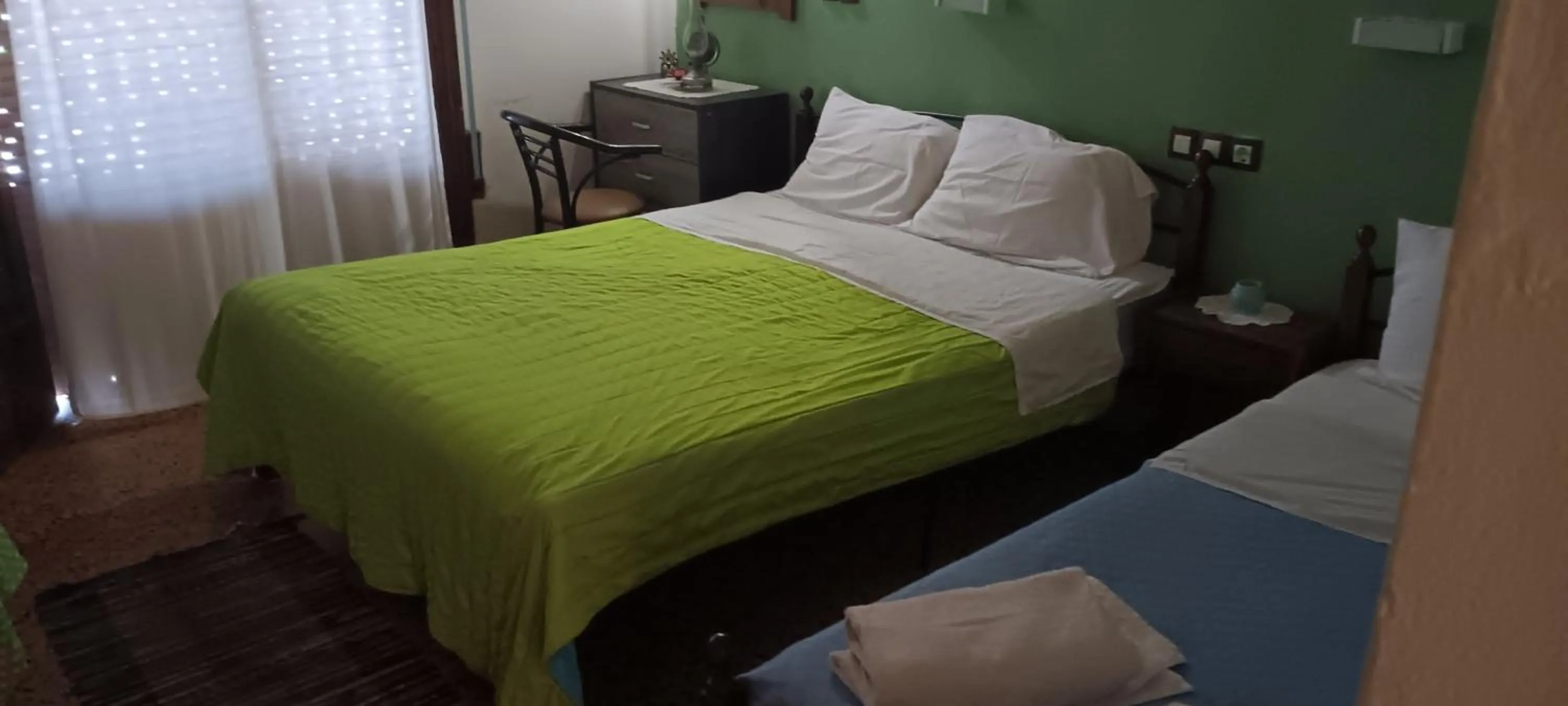 Bed in Hotel zakros rooms-restaurant