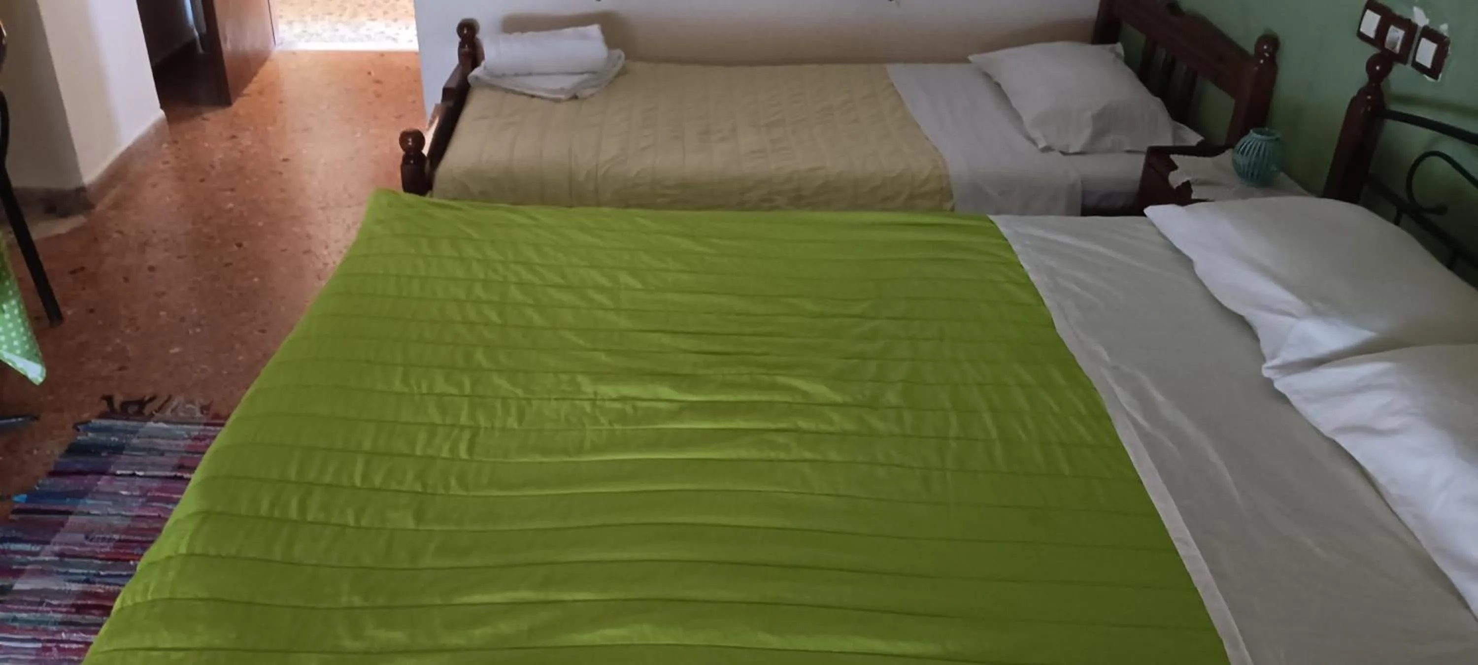 Bed in Hotel zakros rooms-restaurant