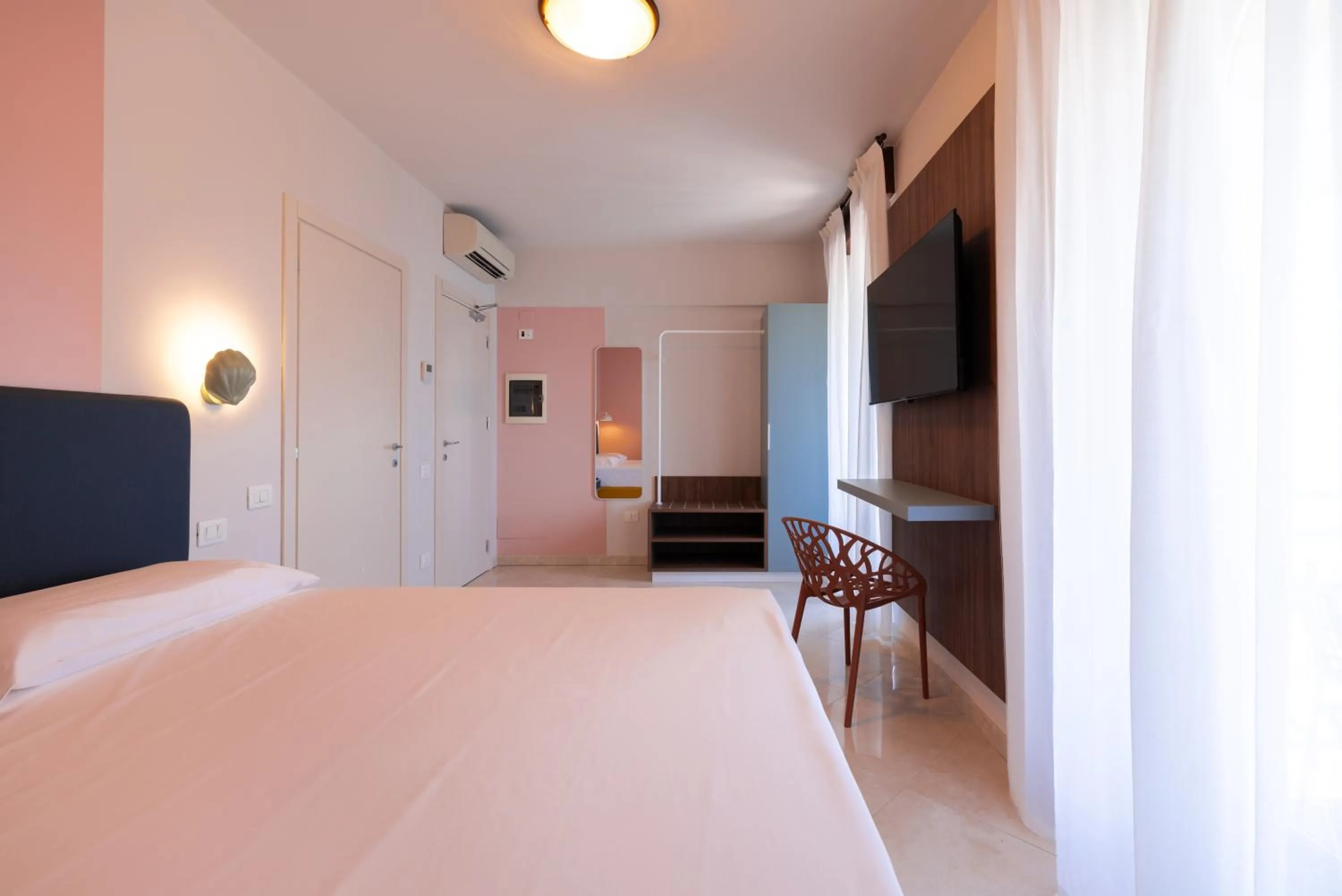 Bed in La Vista Postcard Hotel