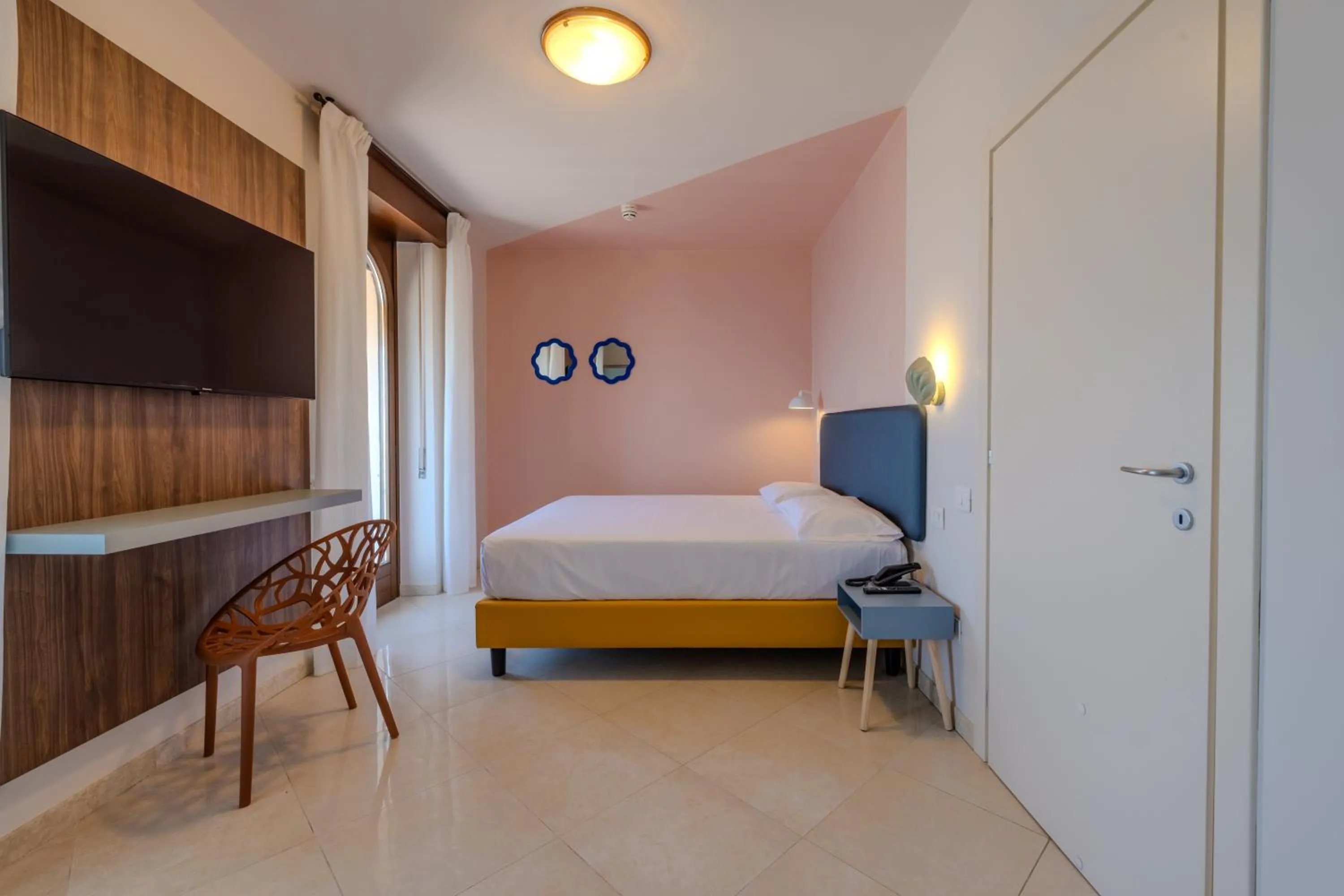 Bed in La Vista Postcard Hotel