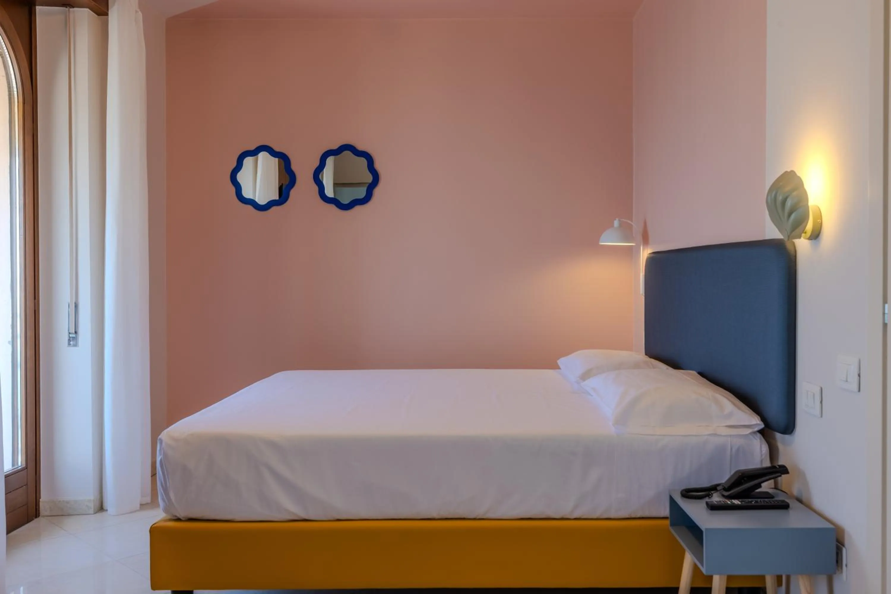 Bed in La Vista Postcard Hotel