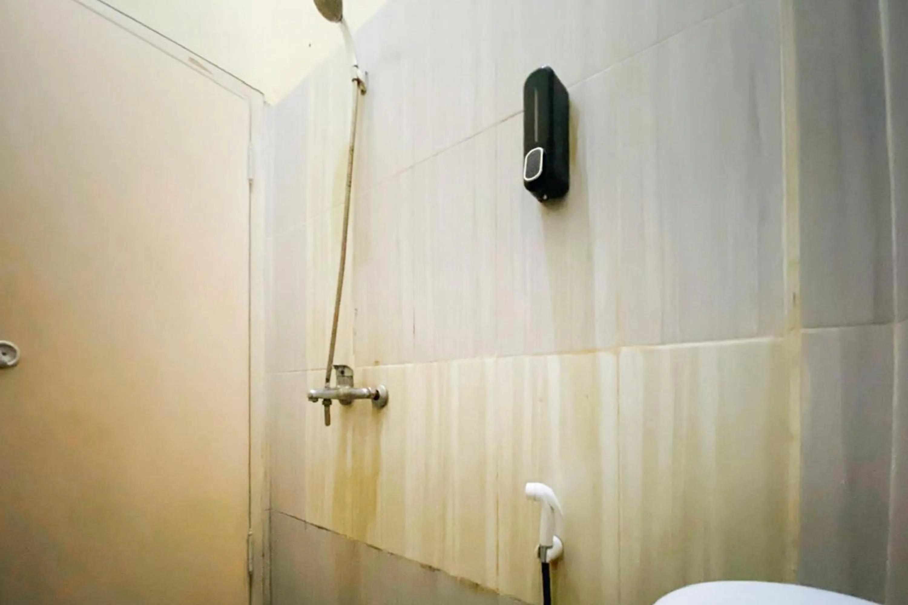 Bathroom in RedDoorz Syariah at Diva Residen Kasturi 1