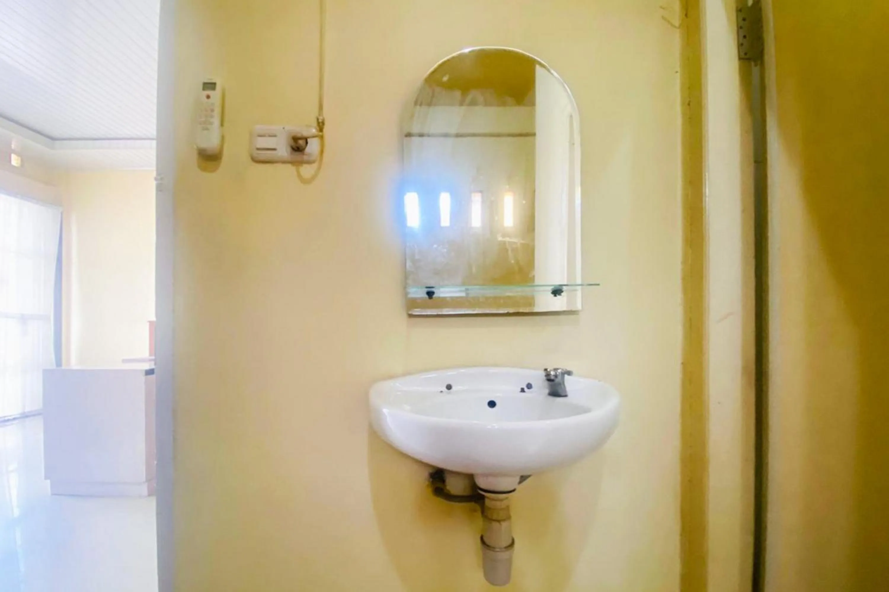 Bathroom in RedDoorz Syariah at Diva Residen Kasturi 1