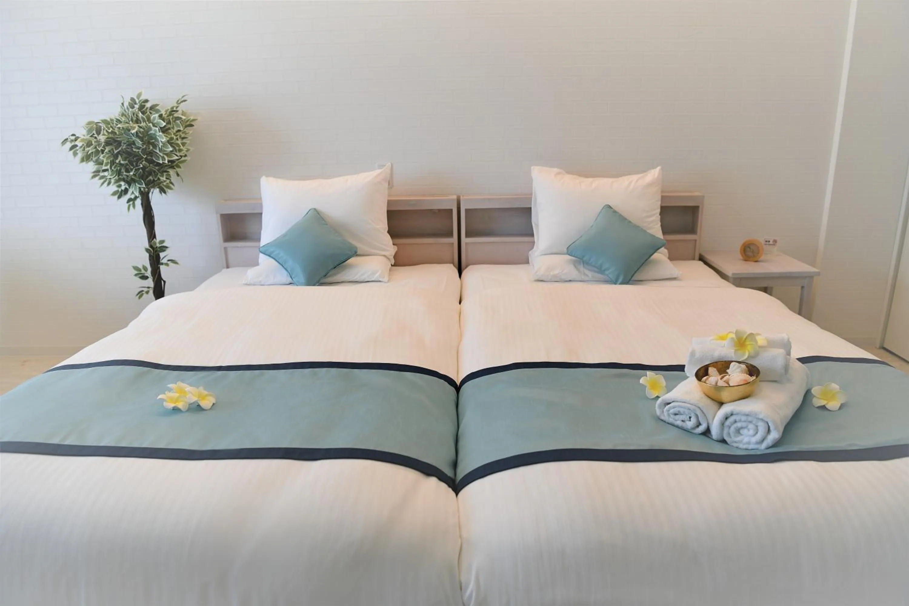 Bed in Pine Hills Hotel Miyakojima