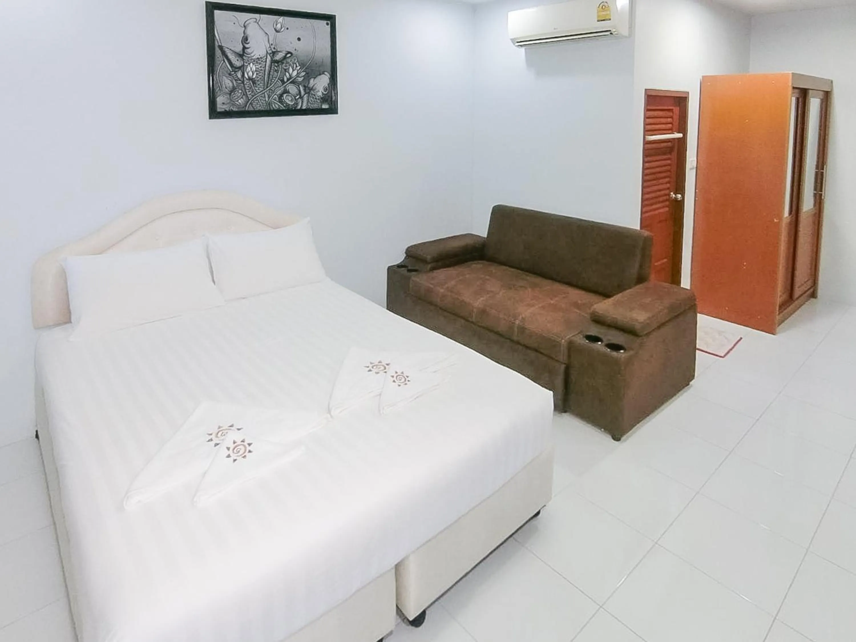 Seating area, Bed in AURA Park Resort