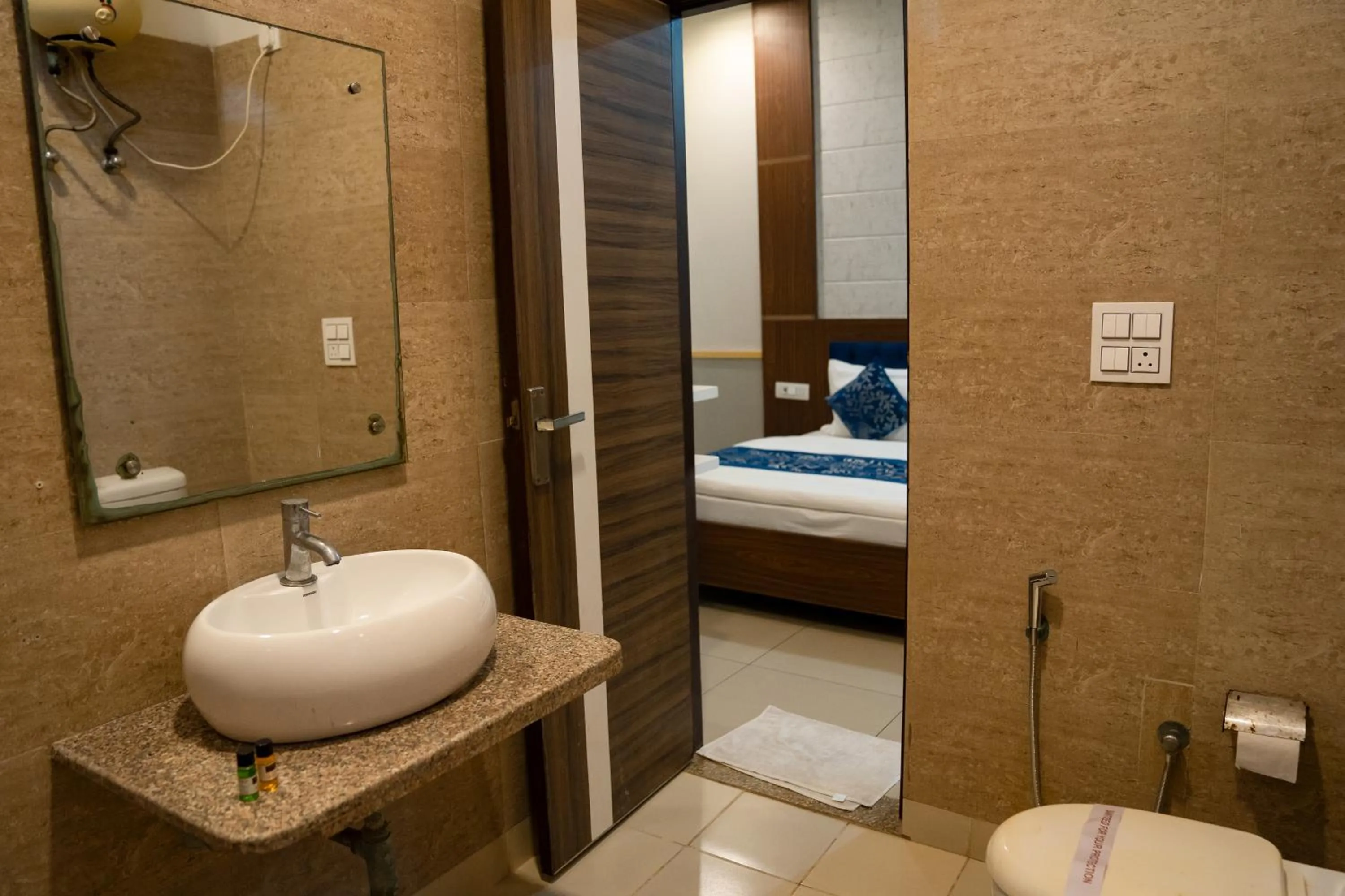 Bathroom, Bed in Vrinda Anandam Resort