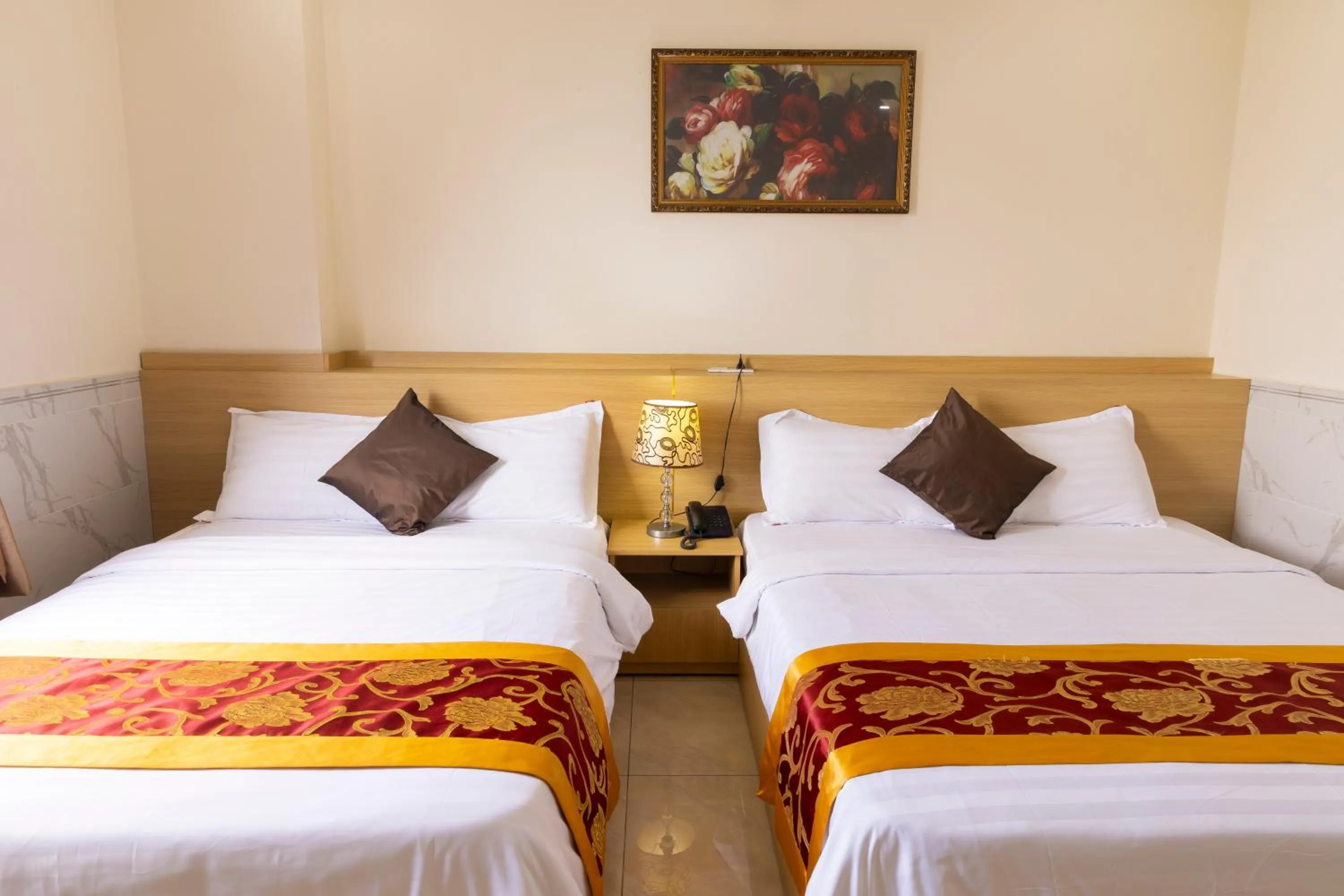 Bed in California Saigon Hotel