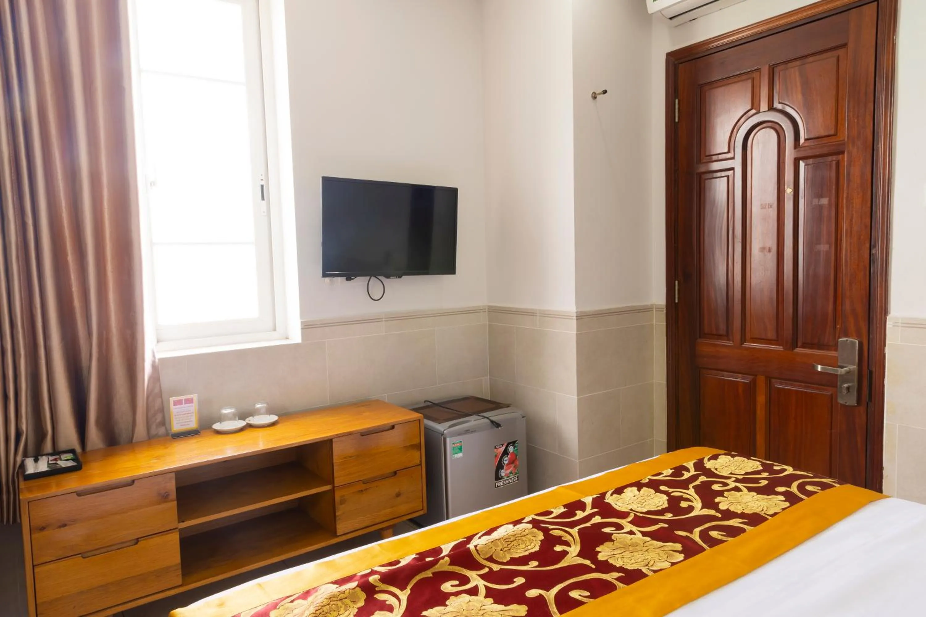 Bed in California Saigon Hotel