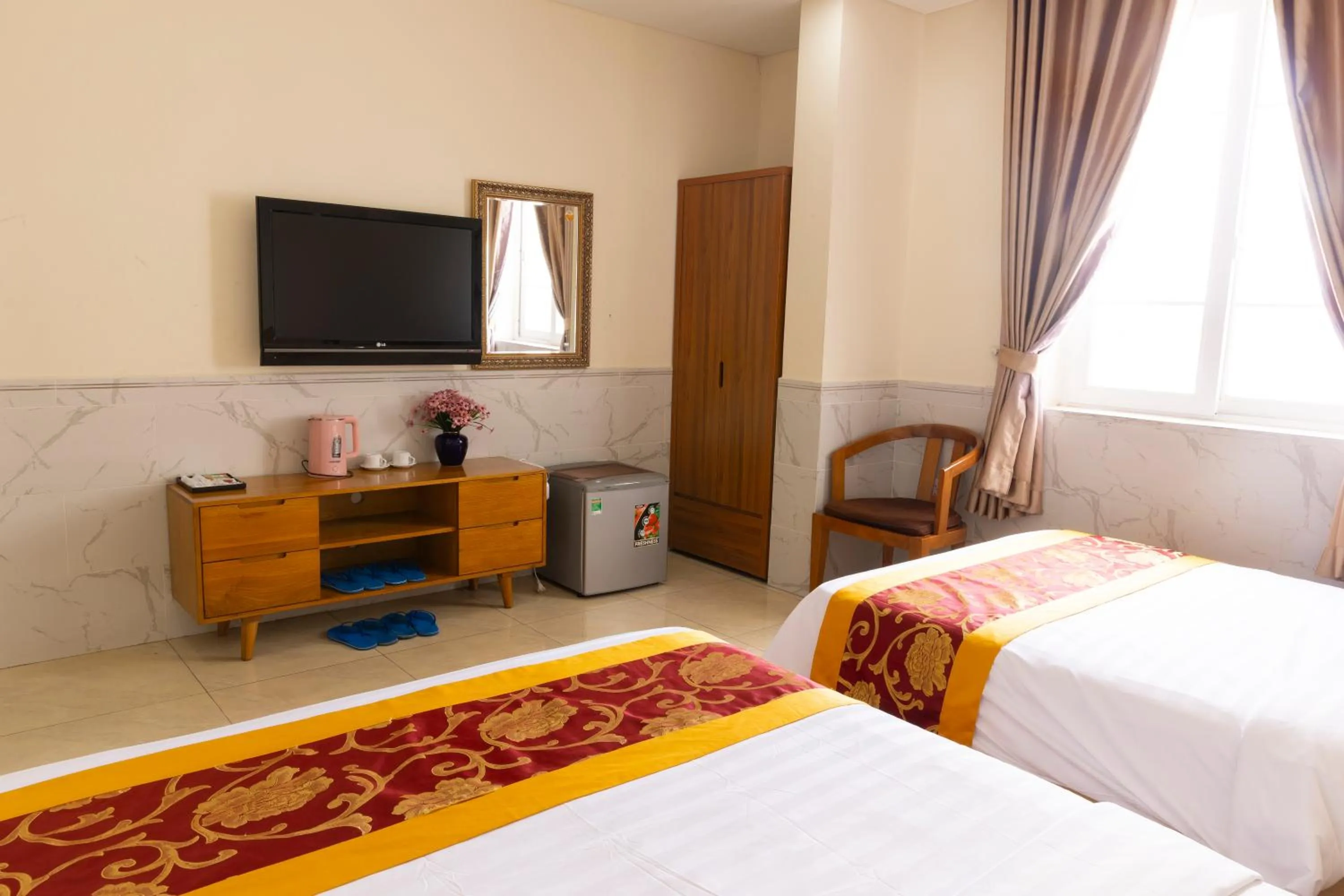 Bed in California Saigon Hotel