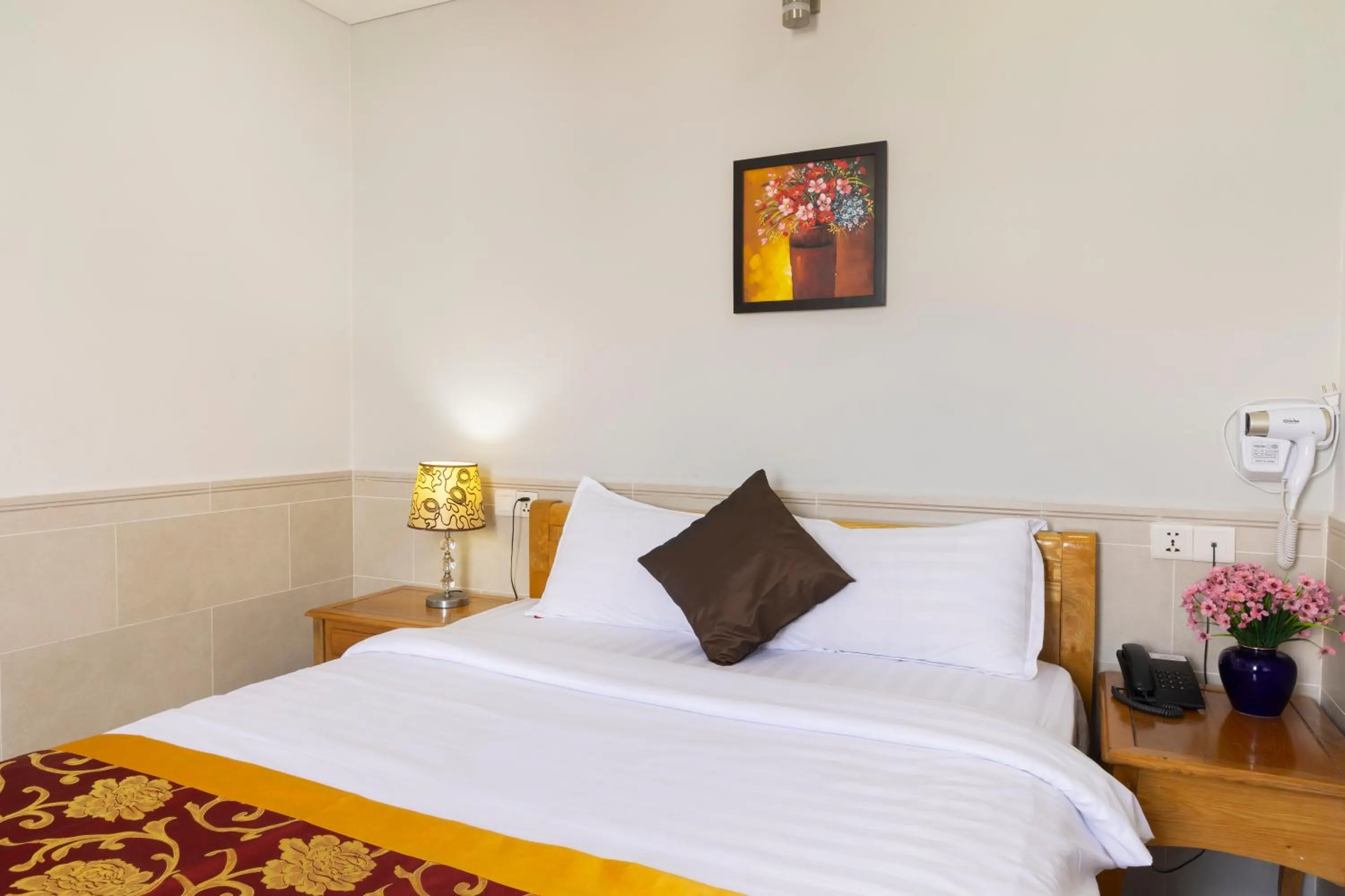 Bed in California Saigon Hotel