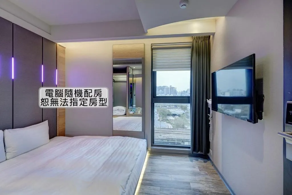 Bed in KIWI SHARE HOTEL ZHONGLI