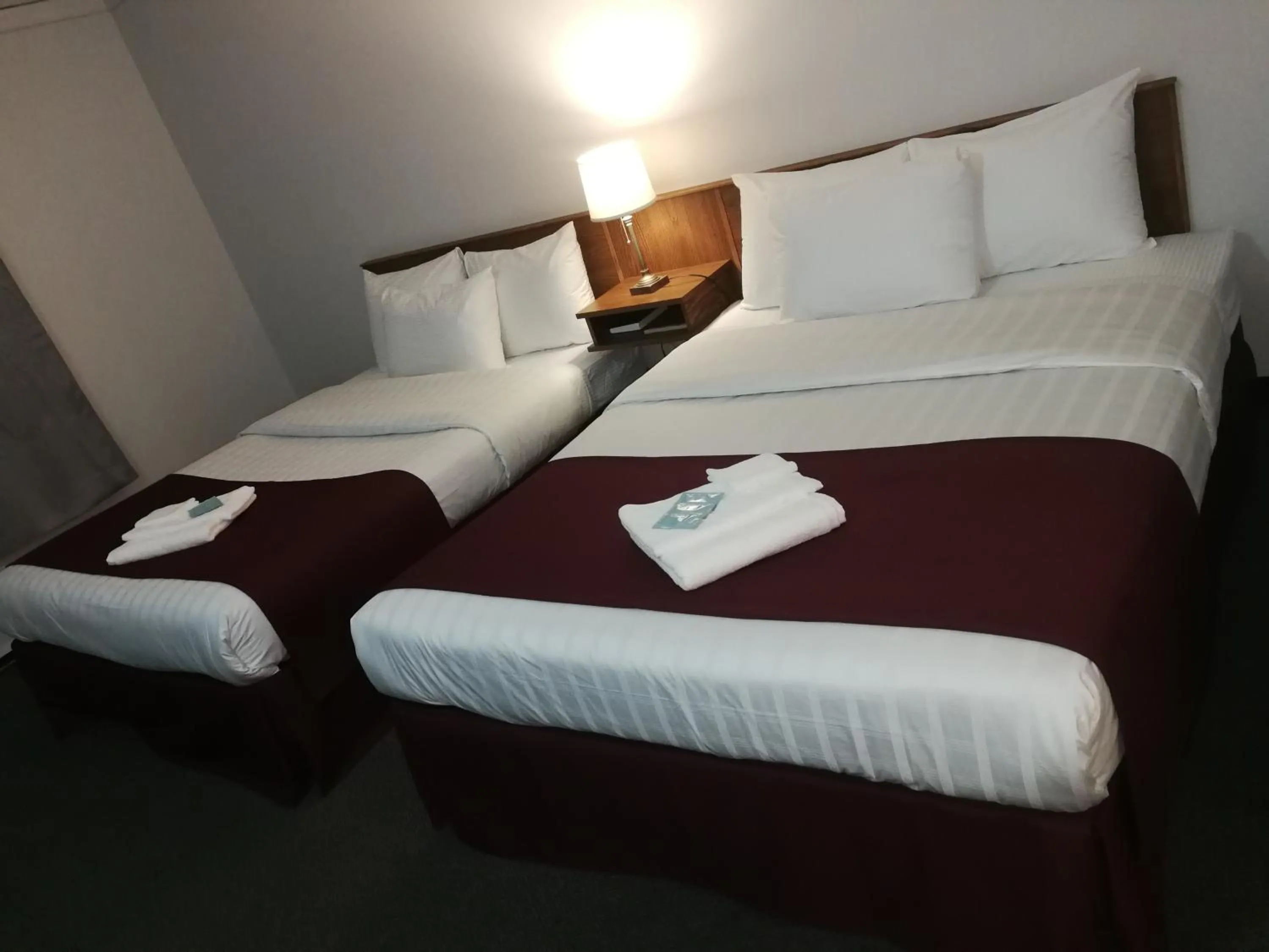 Bed in Sundowner Motel