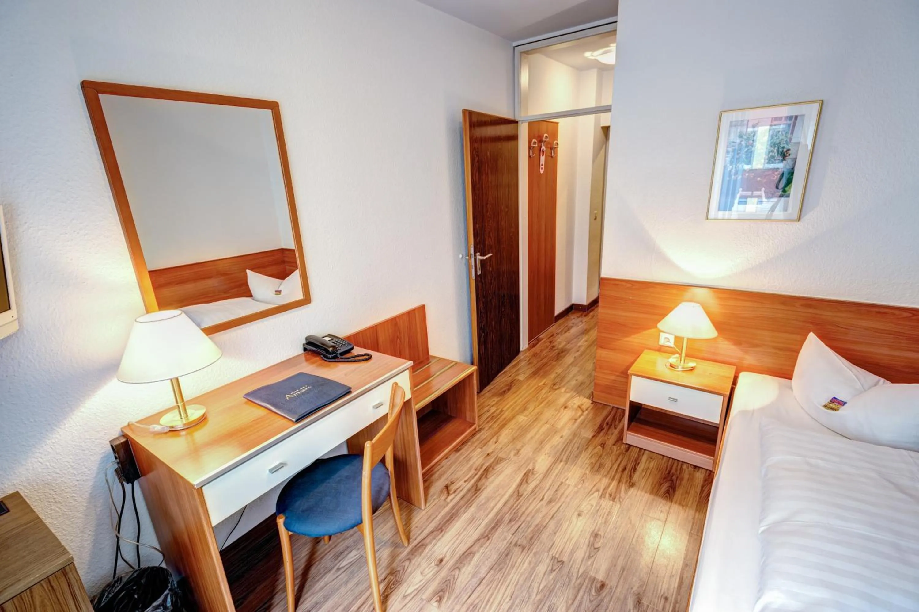 Photo of the whole room, Bed in Hotel Antares München