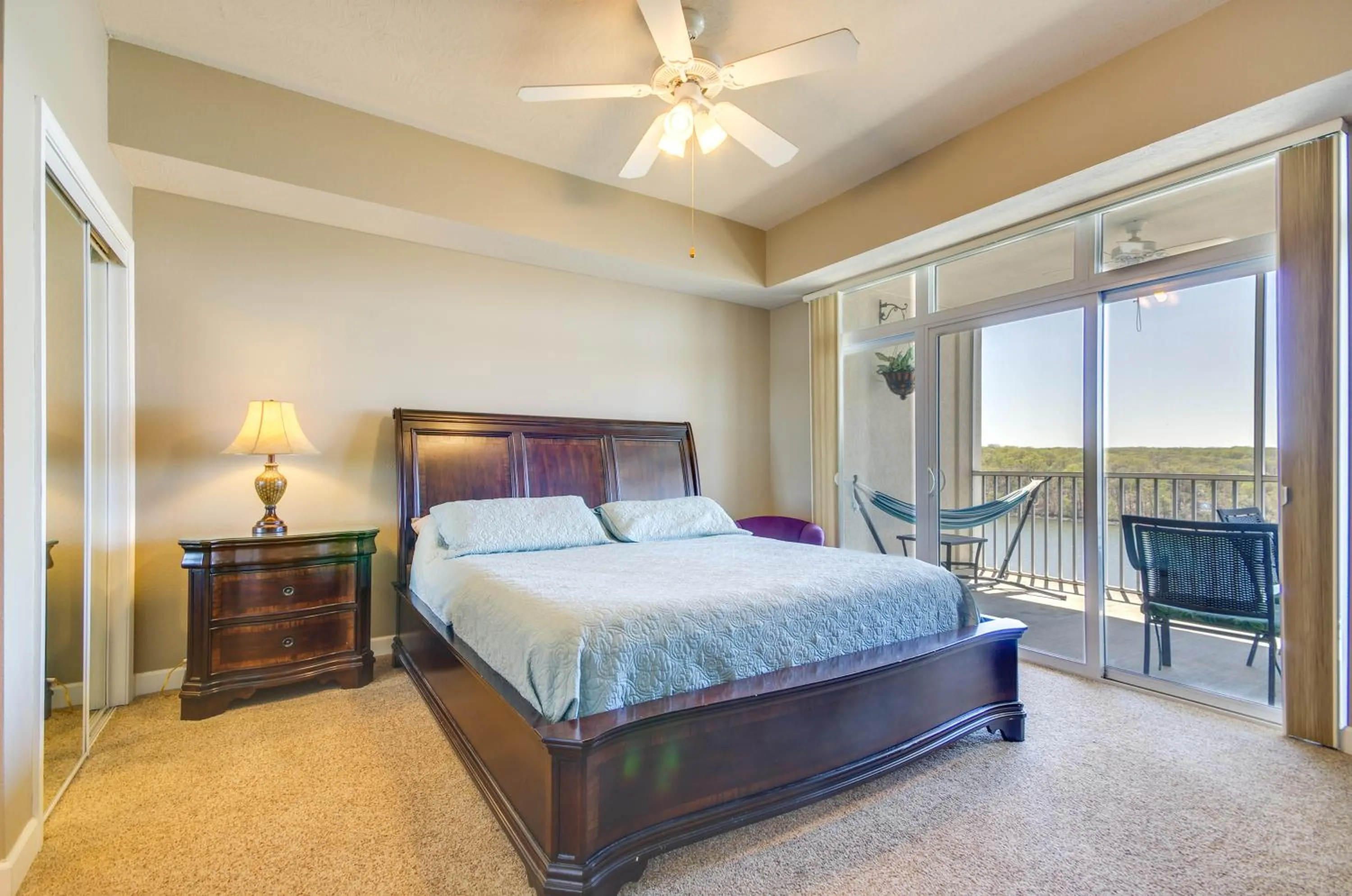 Bed in Lakefront Osage Beach Condo Balcony and Pool Access