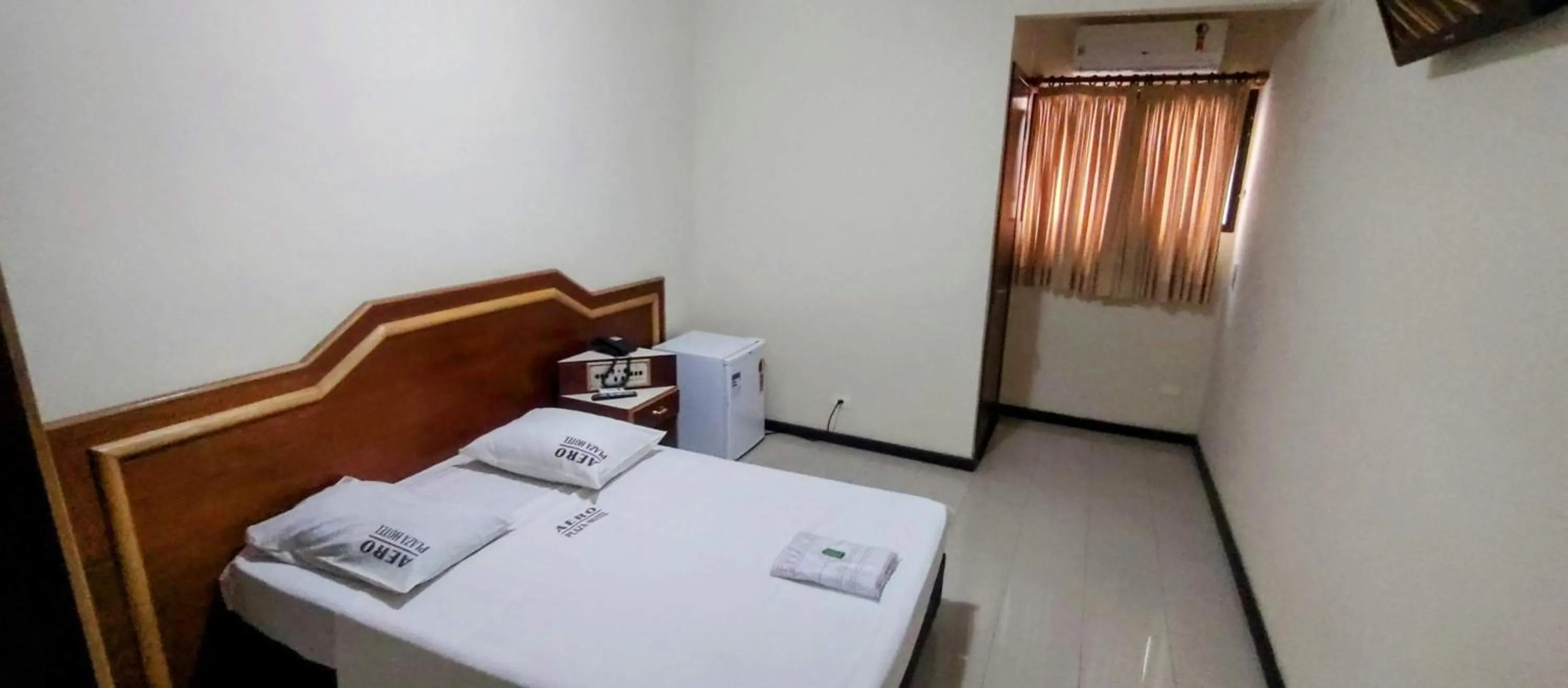 Bed in Aero Plaza Hotel