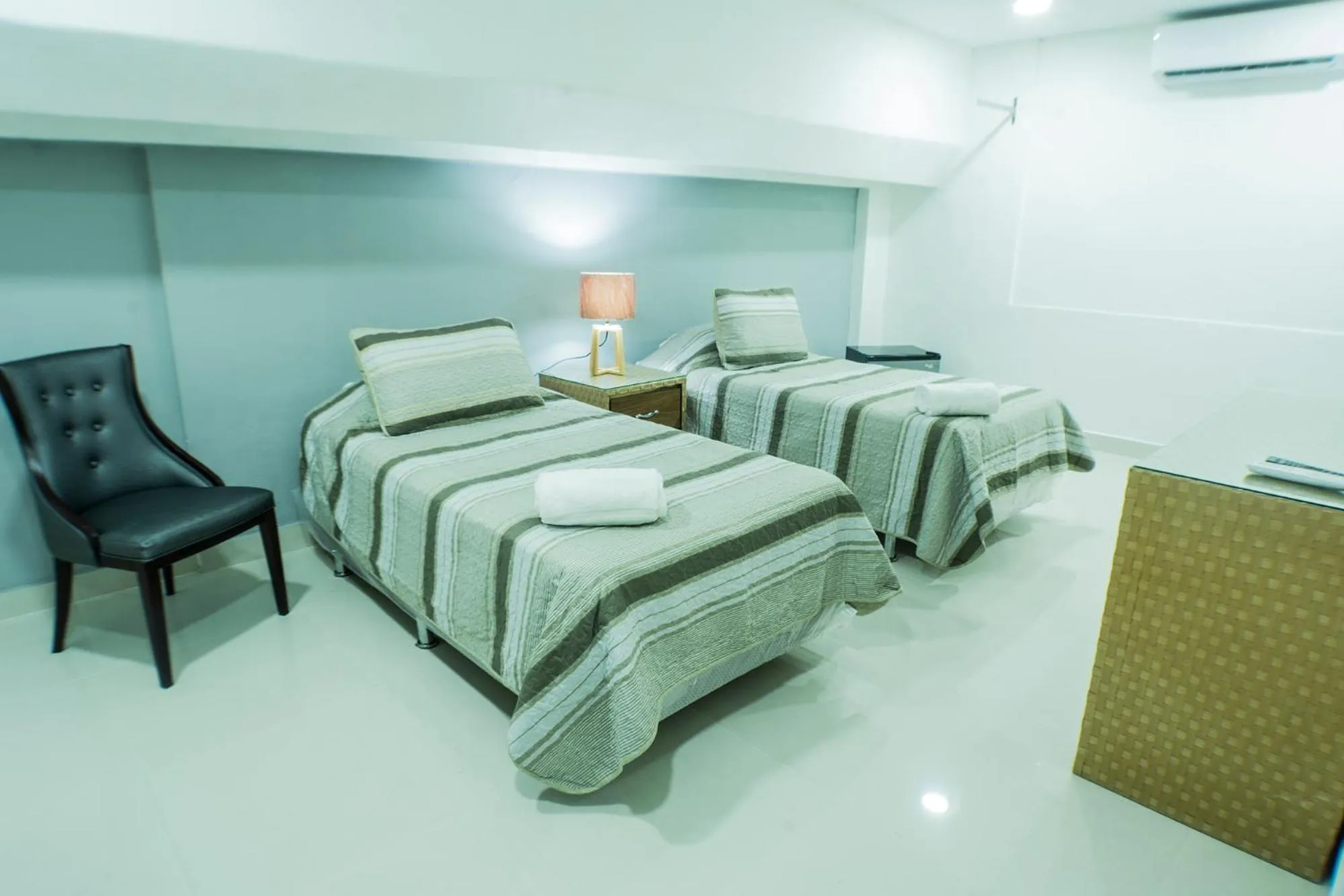 Bed in Malecon Premium Rooms & Hotel