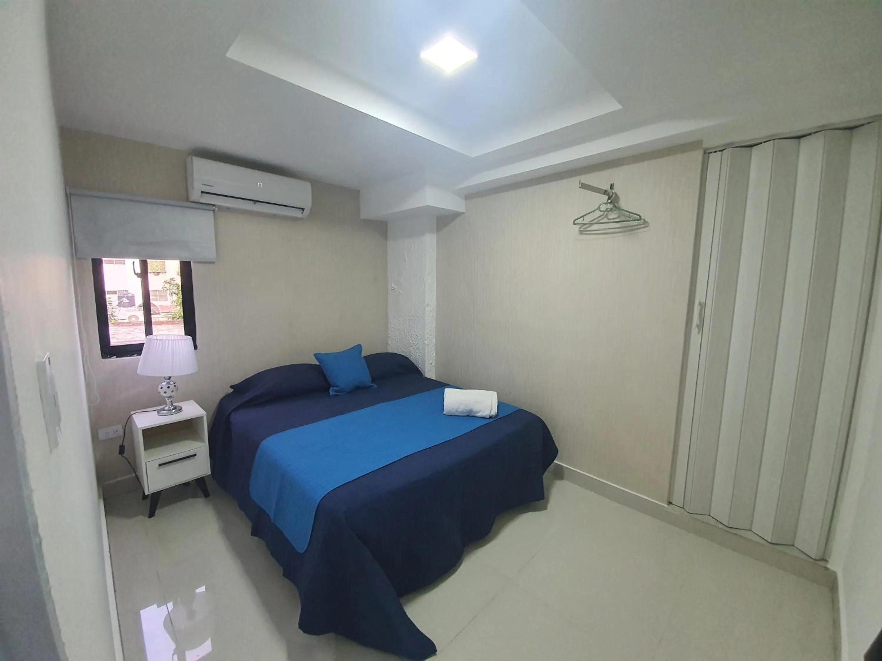 Bed in Malecon Premium Rooms & Hotel