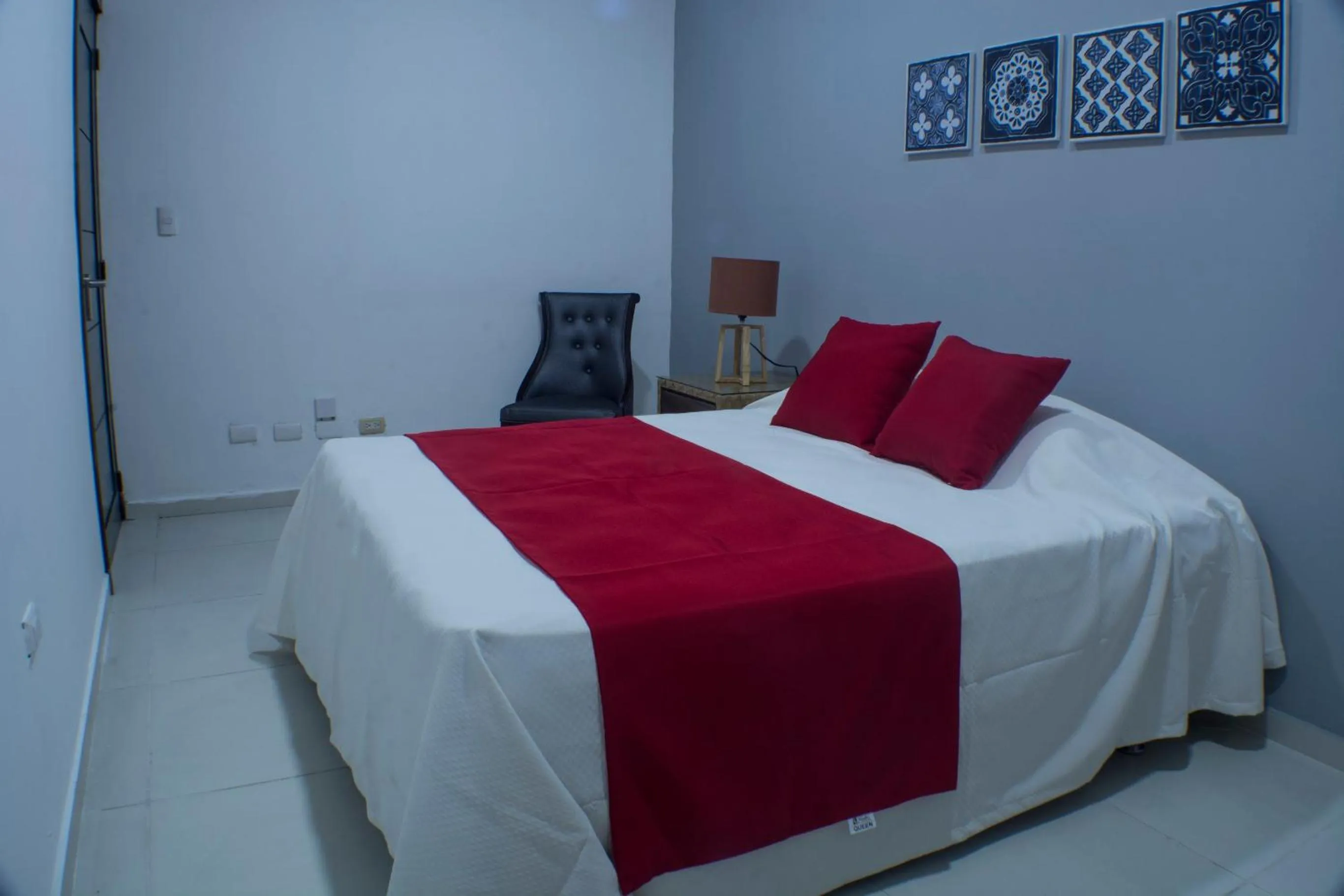 Bed in Malecon Premium Rooms & Hotel