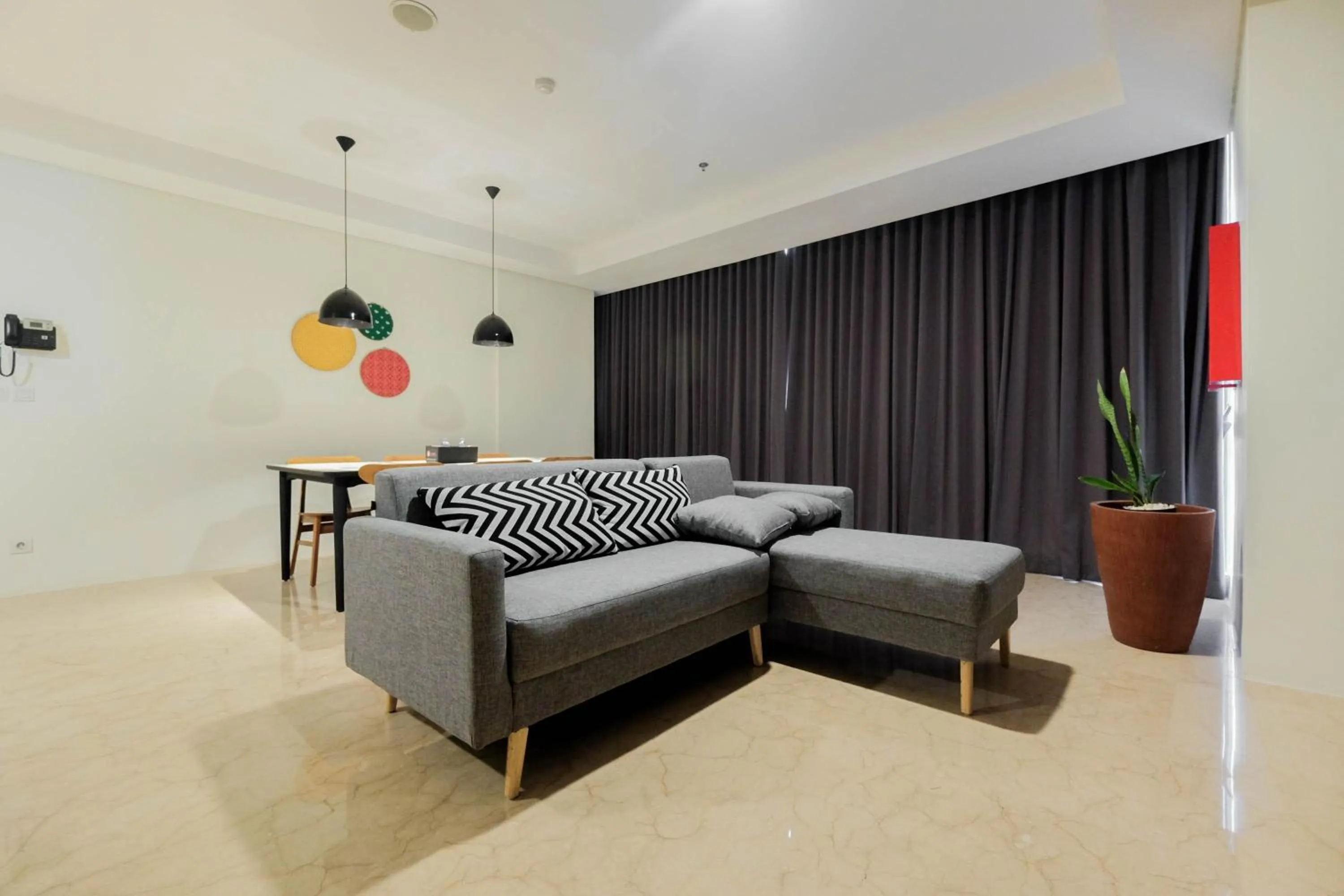 Living room in Comfy 3BR at L'Avenue Apartment Pancoran By Travelio