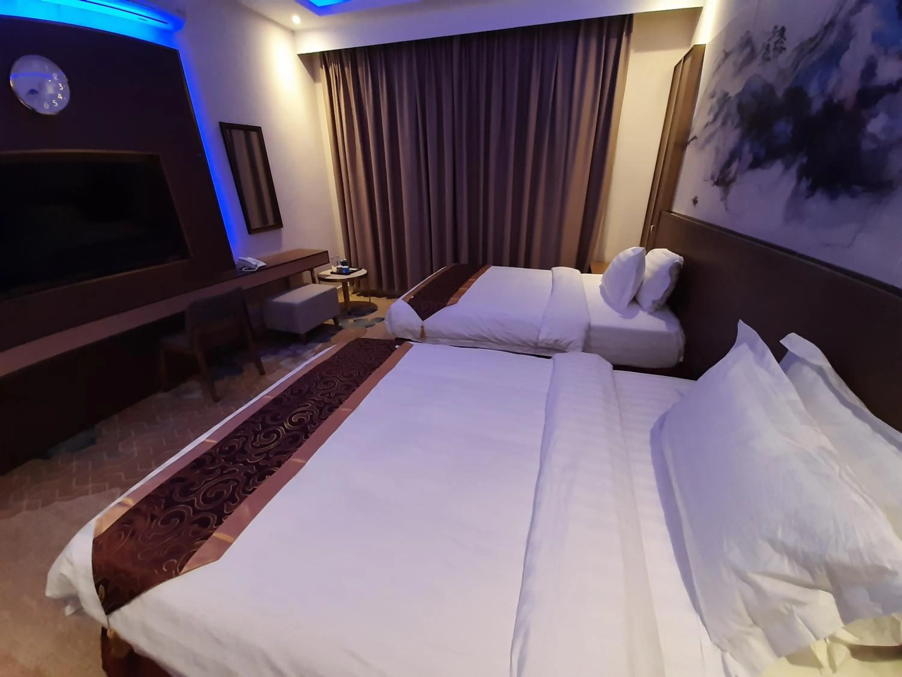 Bed in Qasr Alshamal Hotel