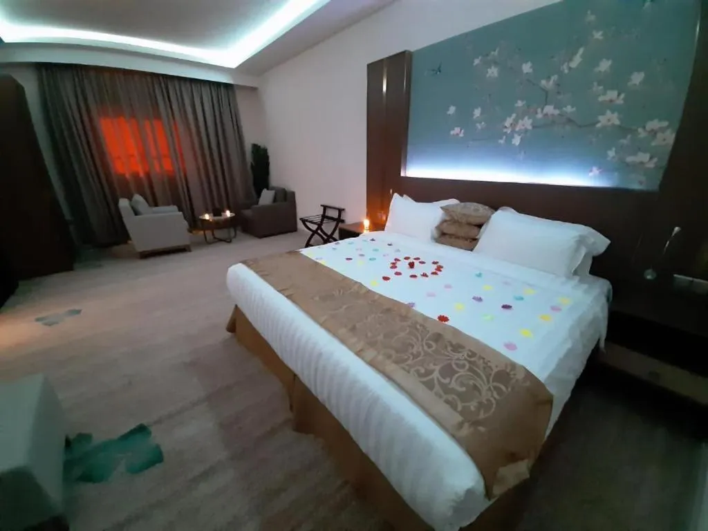 Bed in Qasr Alshamal Hotel