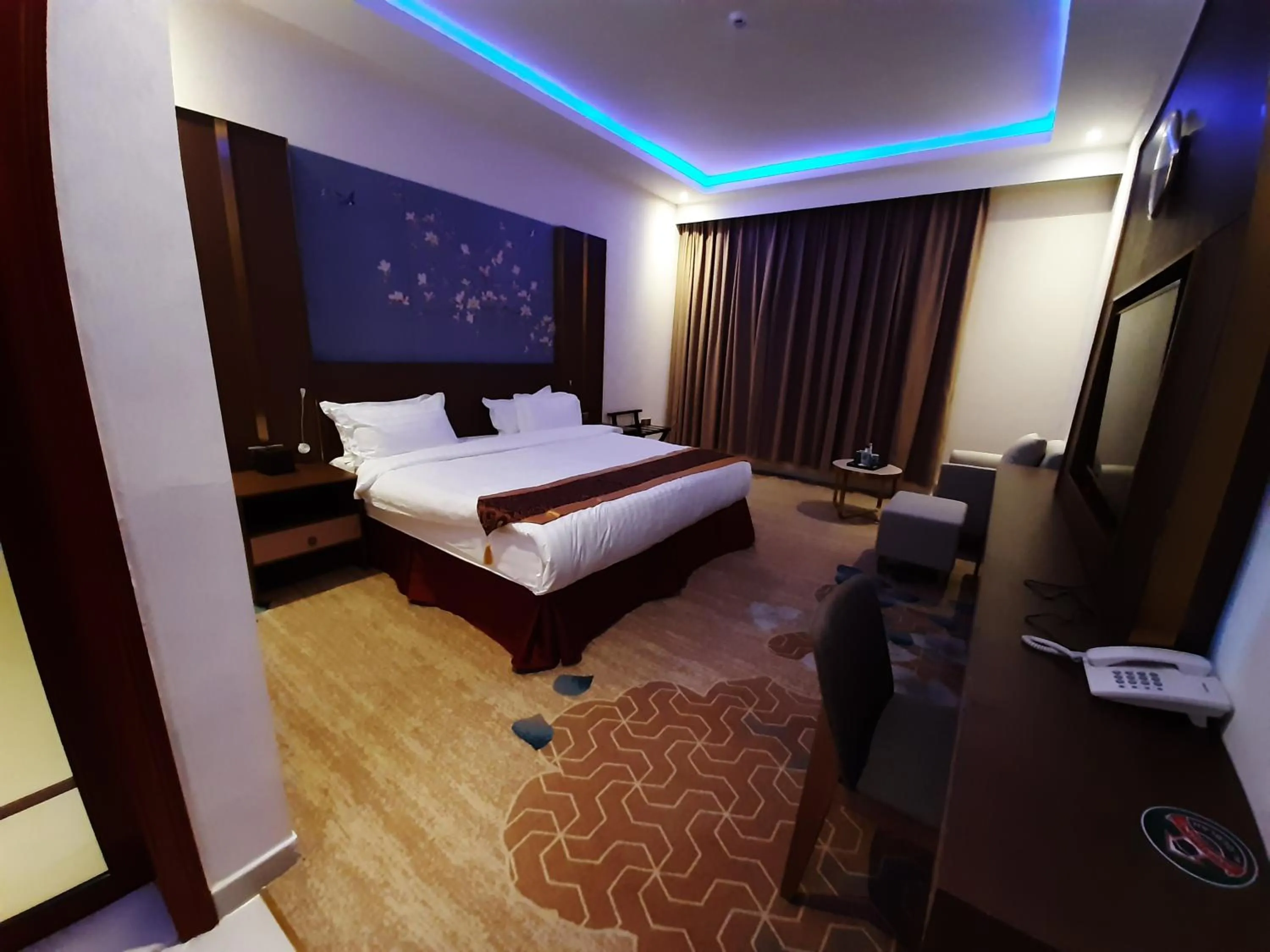 Bed in Qasr Alshamal Hotel