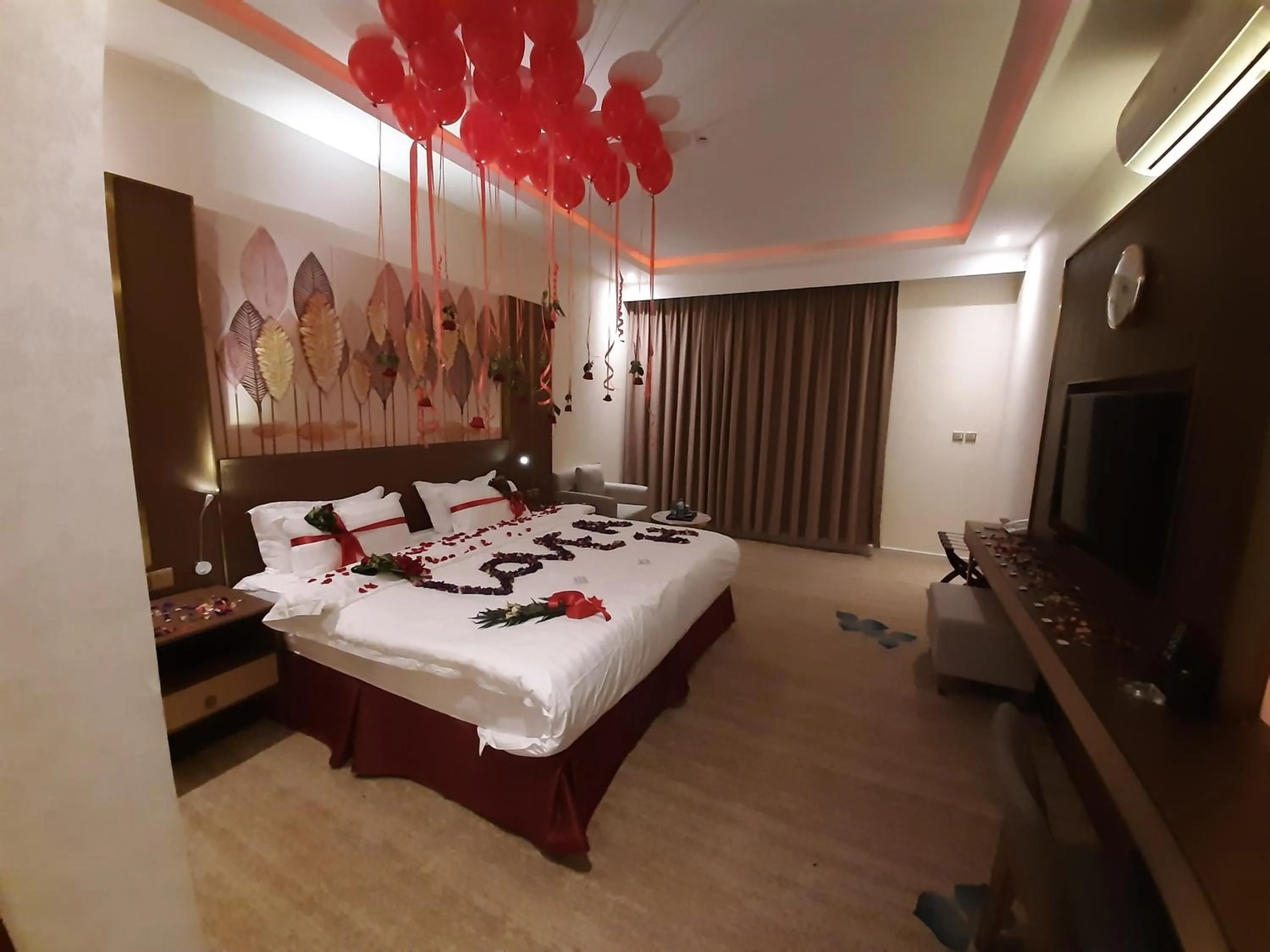 Bed in Qasr Alshamal Hotel