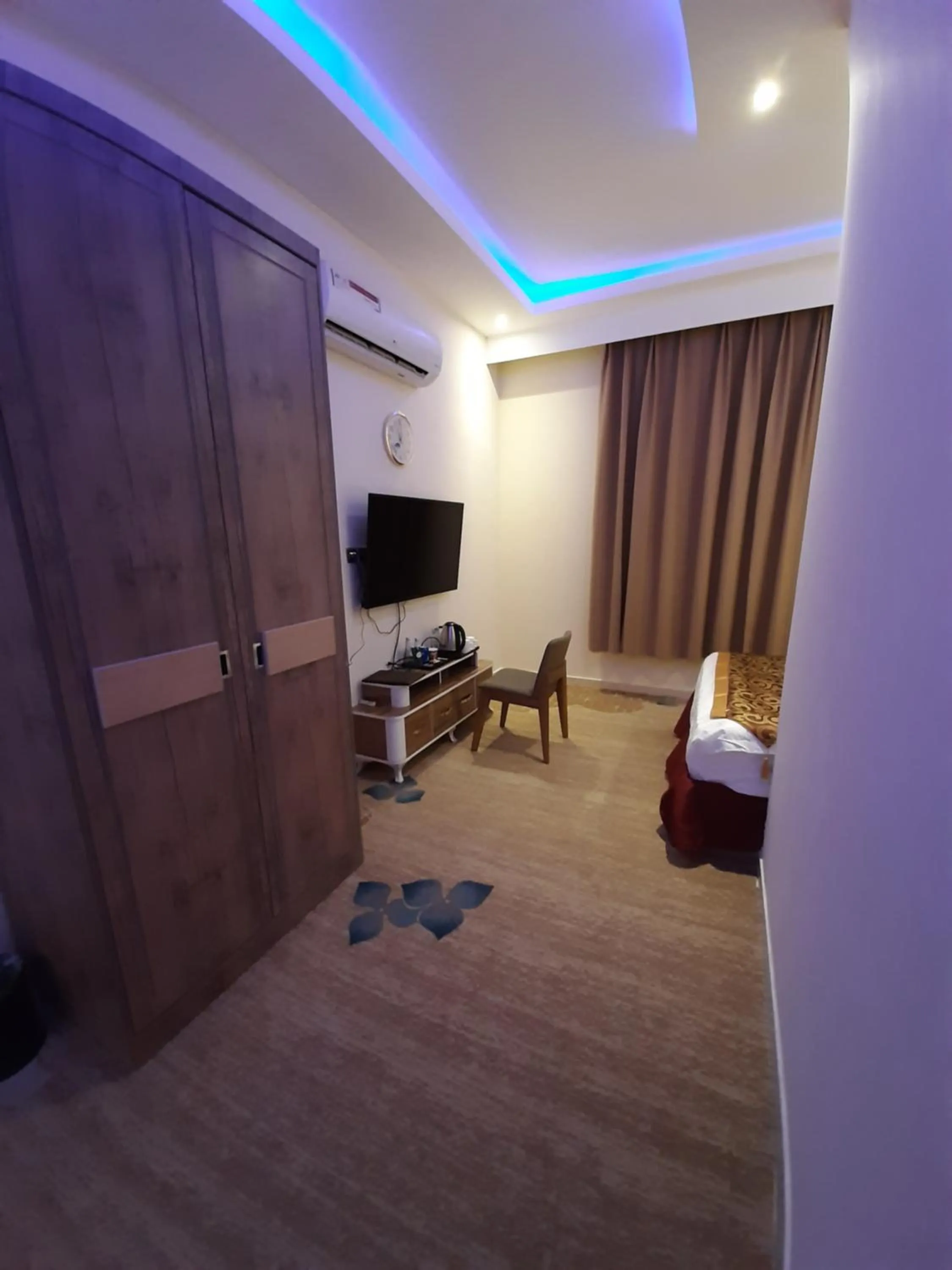 Bed in Qasr Alshamal Hotel