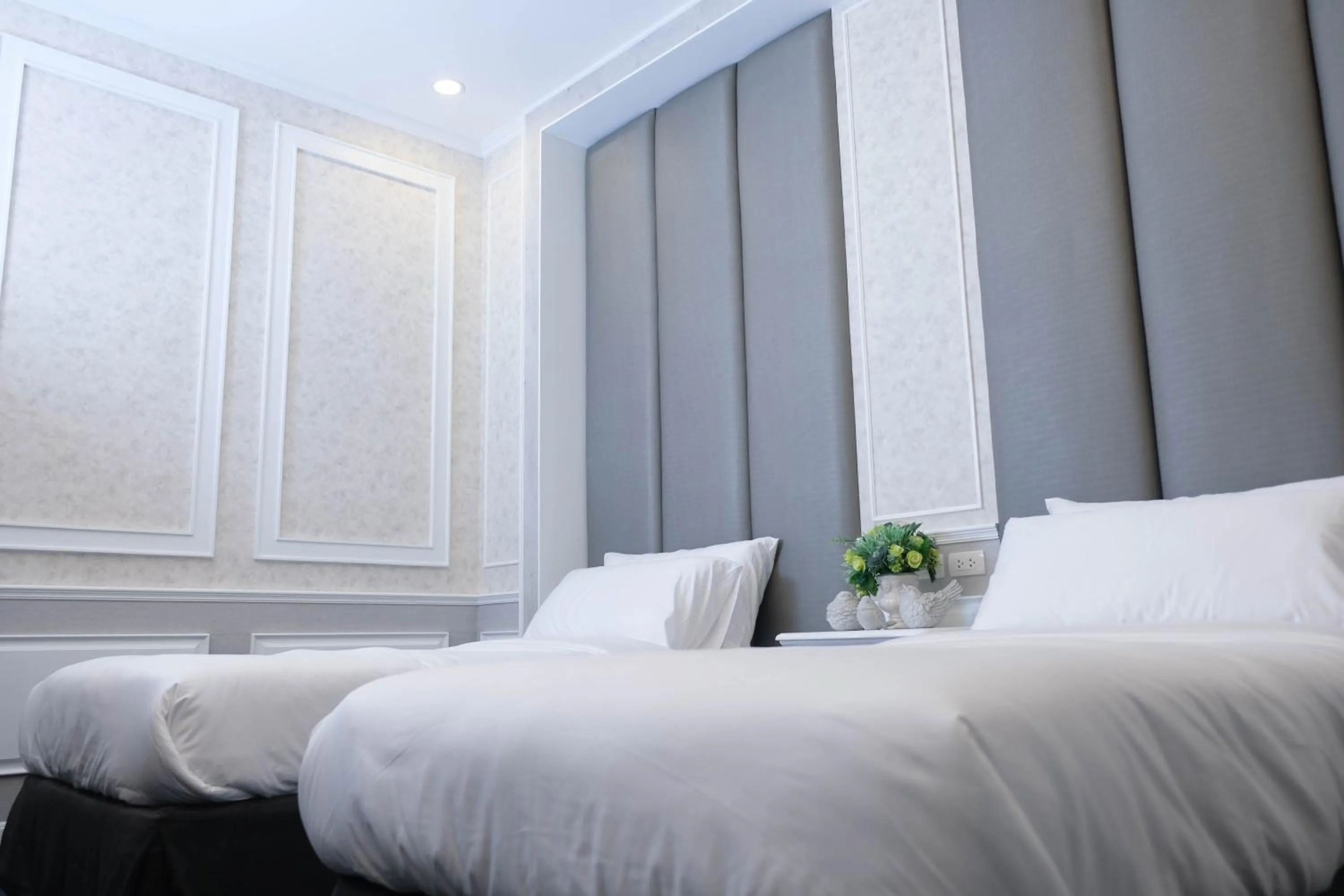 Bed in VARIMANTRA HOTEL