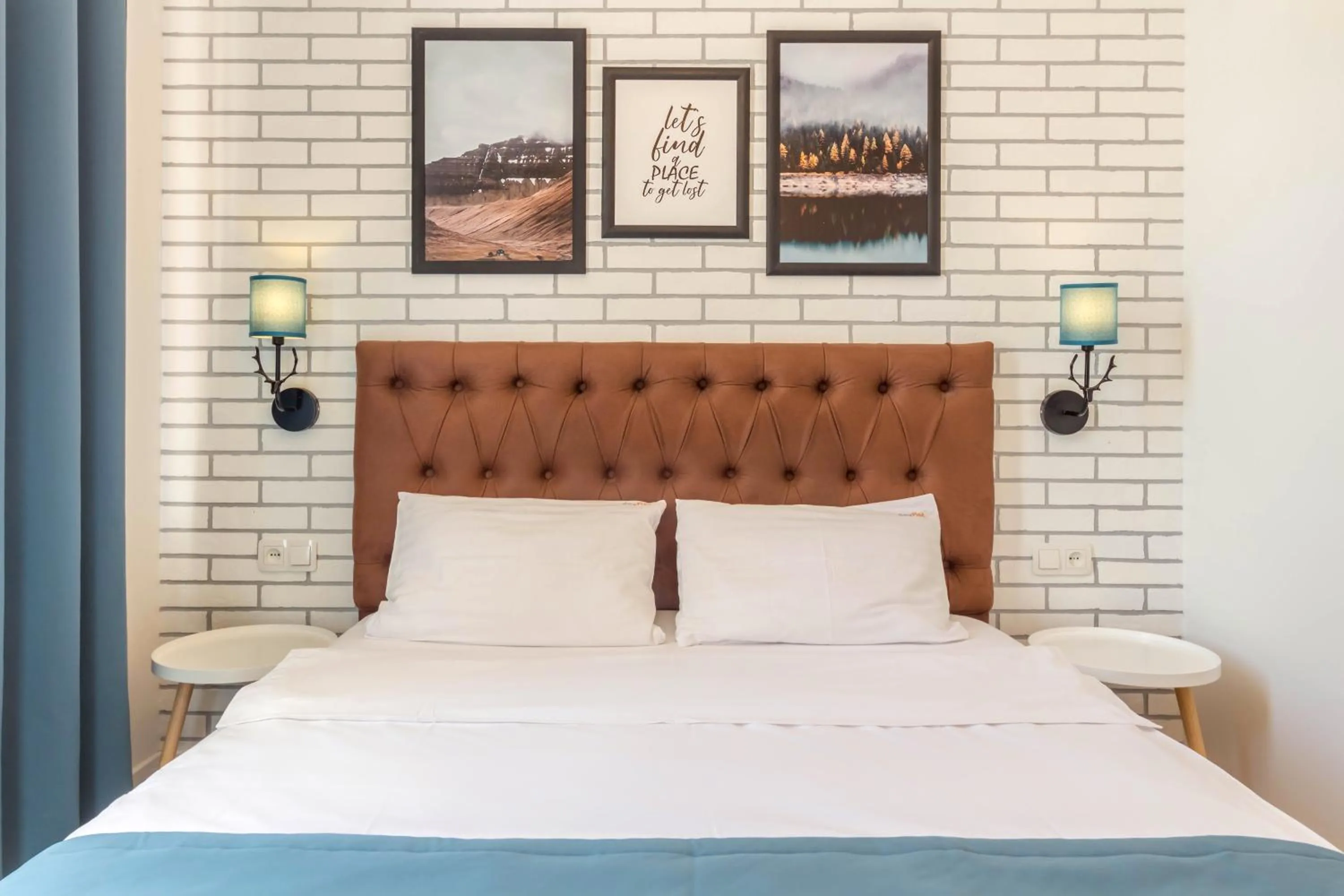 Bed in Scandinavian Apartments