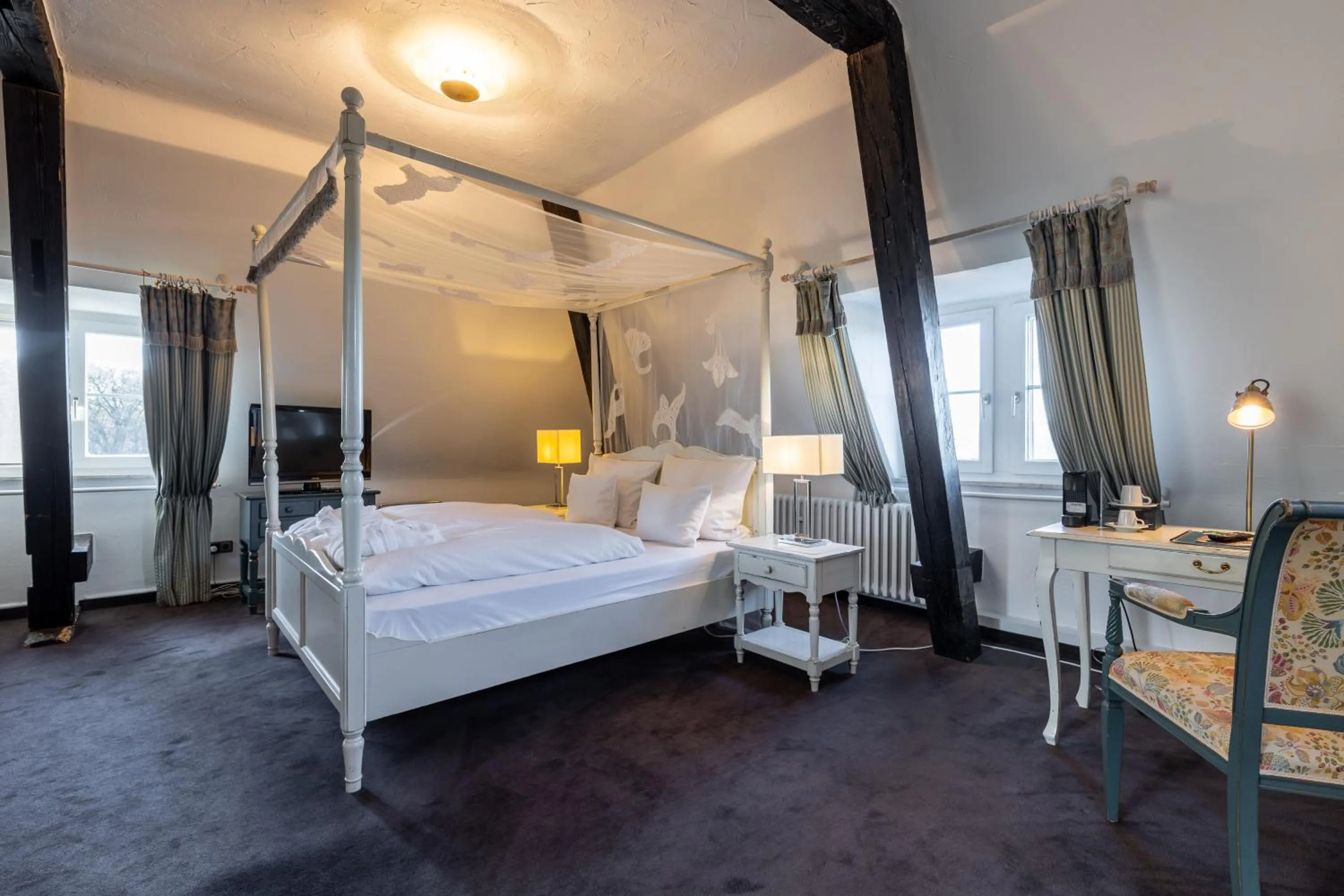 Photo of the whole room, Bed in Jagdschloss Hotel Niederwald