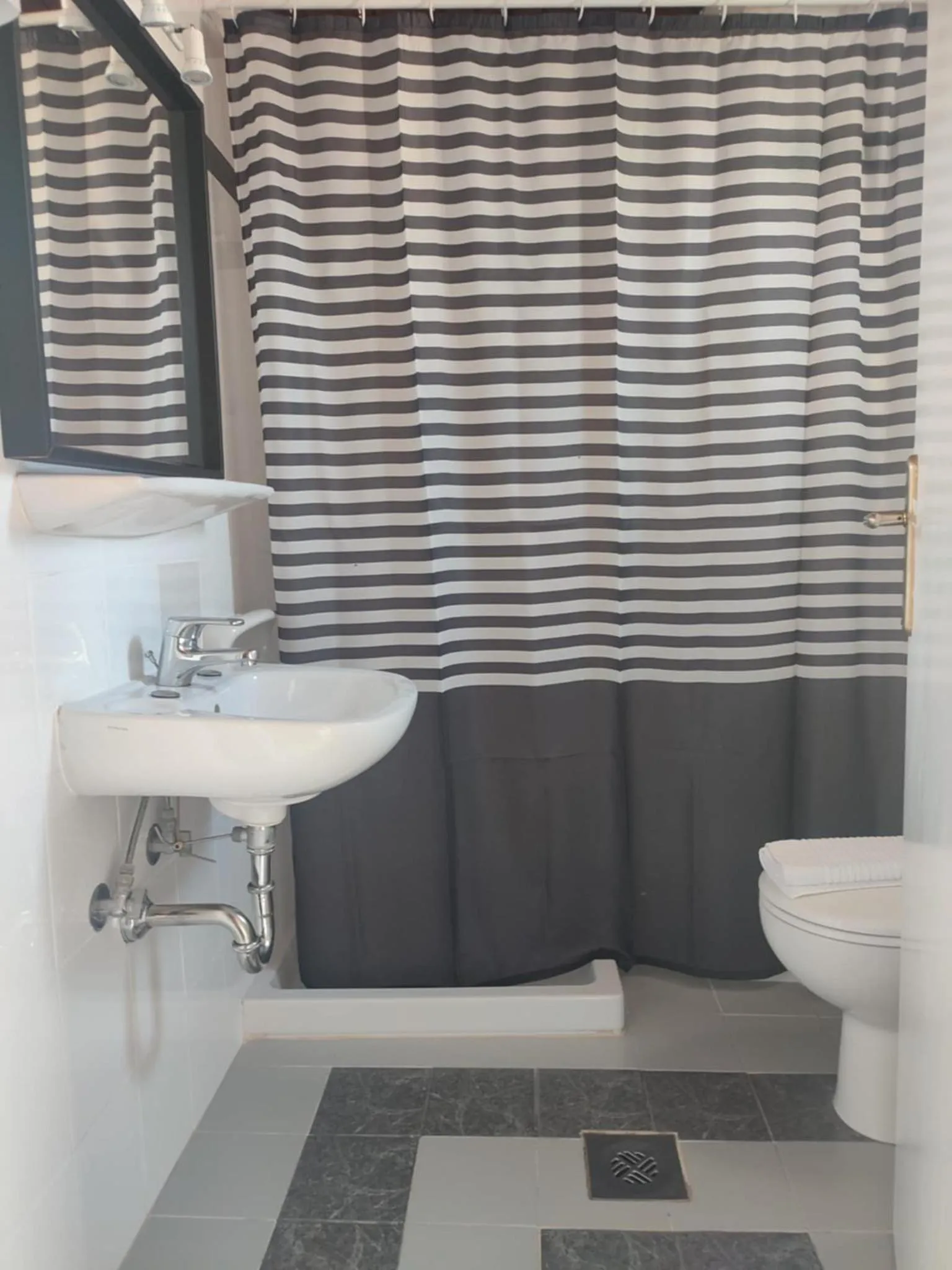 Toilet in Posidonio Hotel