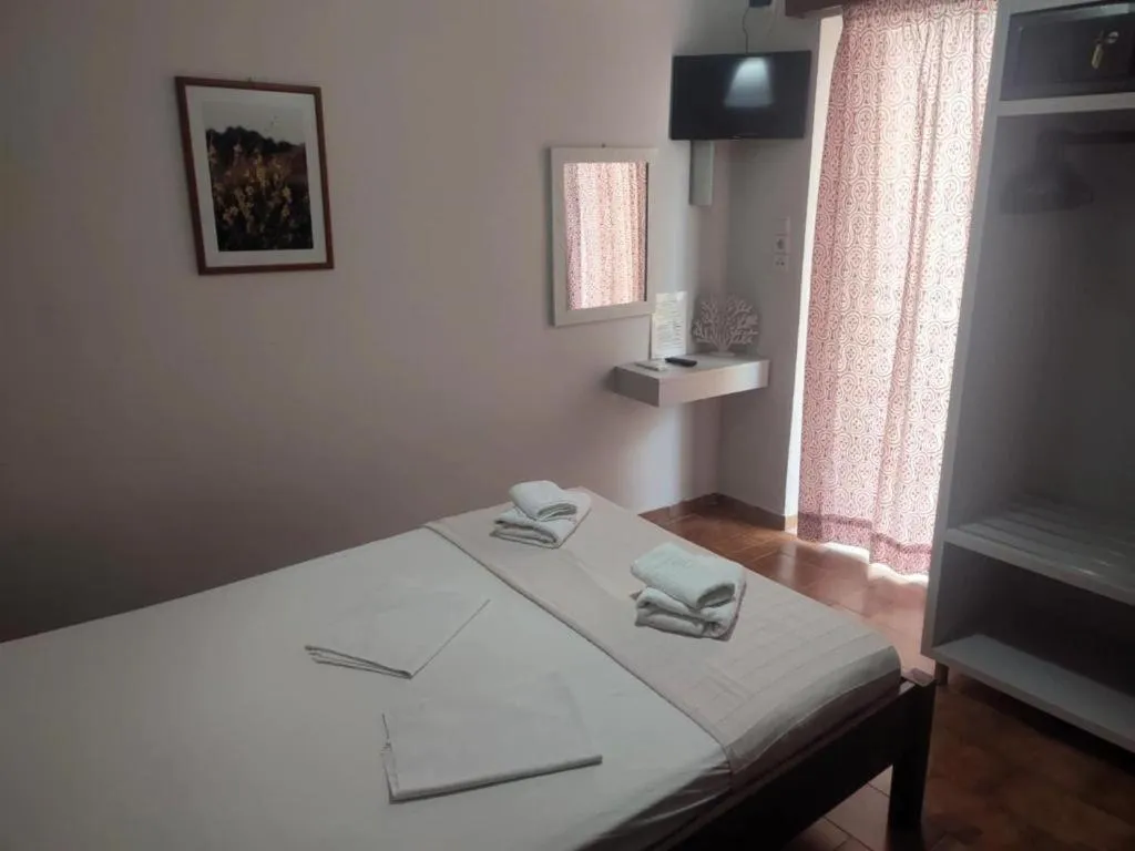 Bed in Posidonio Hotel