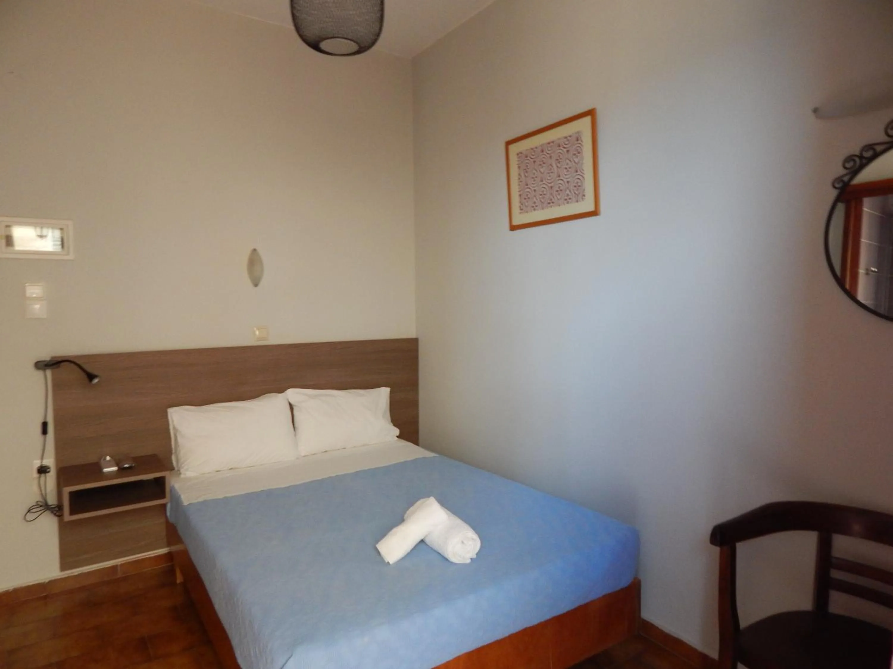 Bed in Posidonio Hotel