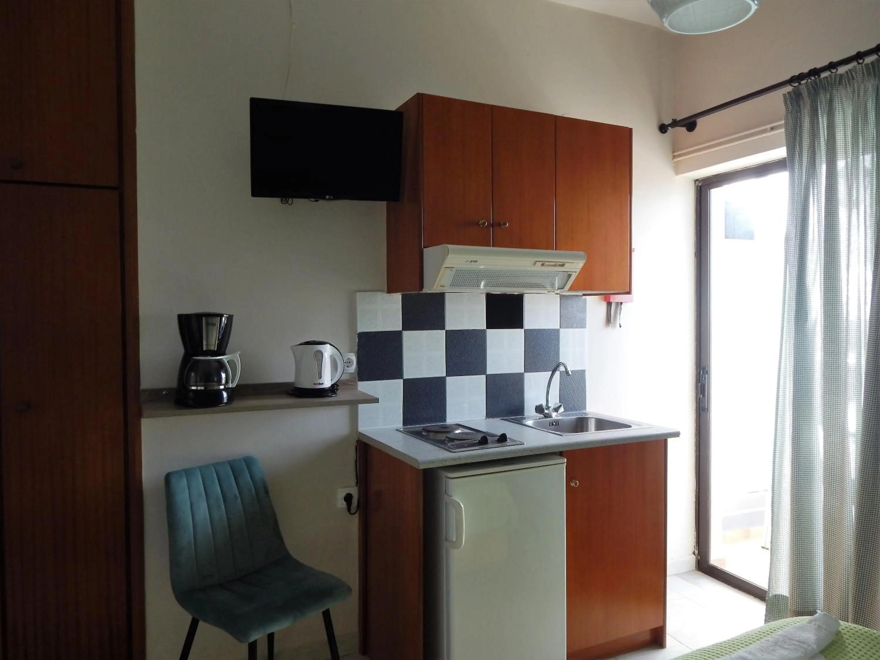 Kitchen or kitchenette in Posidonio Hotel