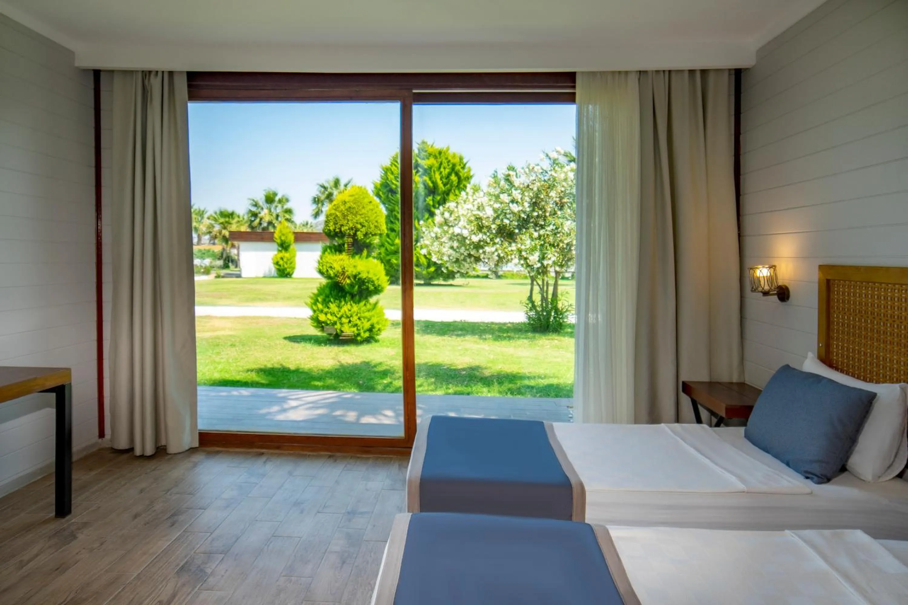 Bed in Risus Beach Resort Hotel