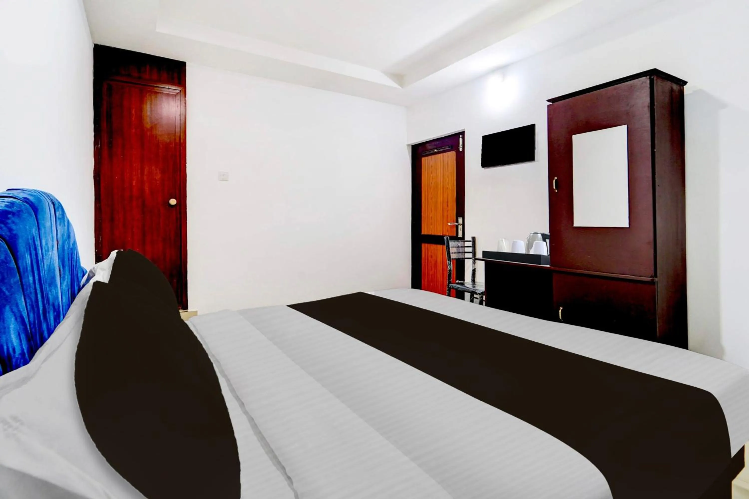 Bedroom, Bed in Super Hotel O Kunnamangalam Near Bus Stand