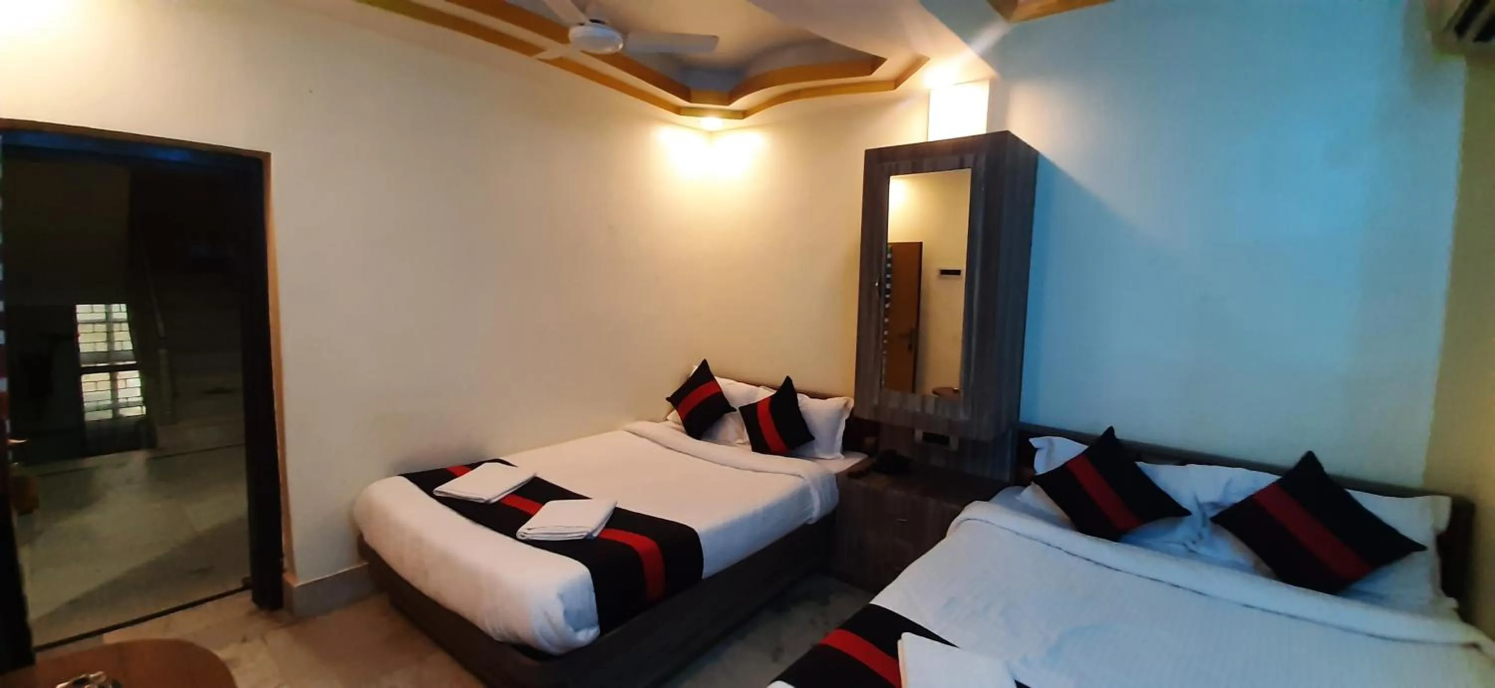 Bed in Snehamaya Spa & Resort