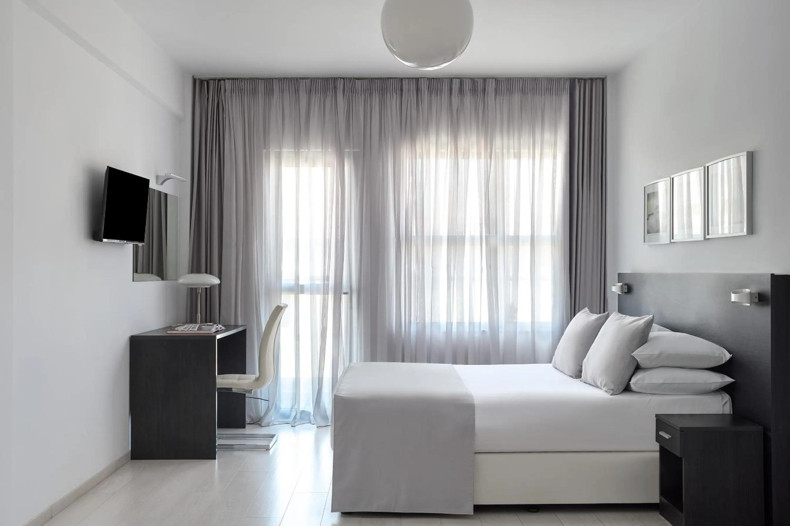 Bed in Boss Boutique Athens by Prima Hotels