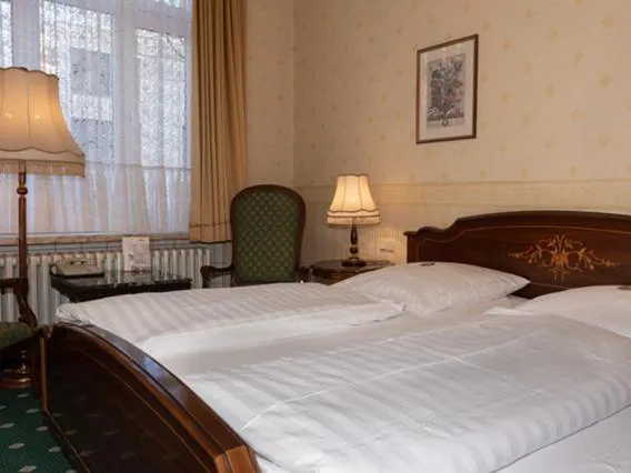 Seating area, Bed in Hotel Stephan