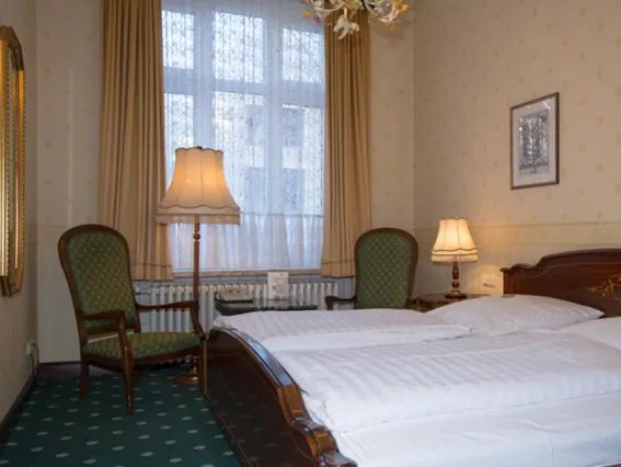 Seating area, Bed in Hotel Stephan