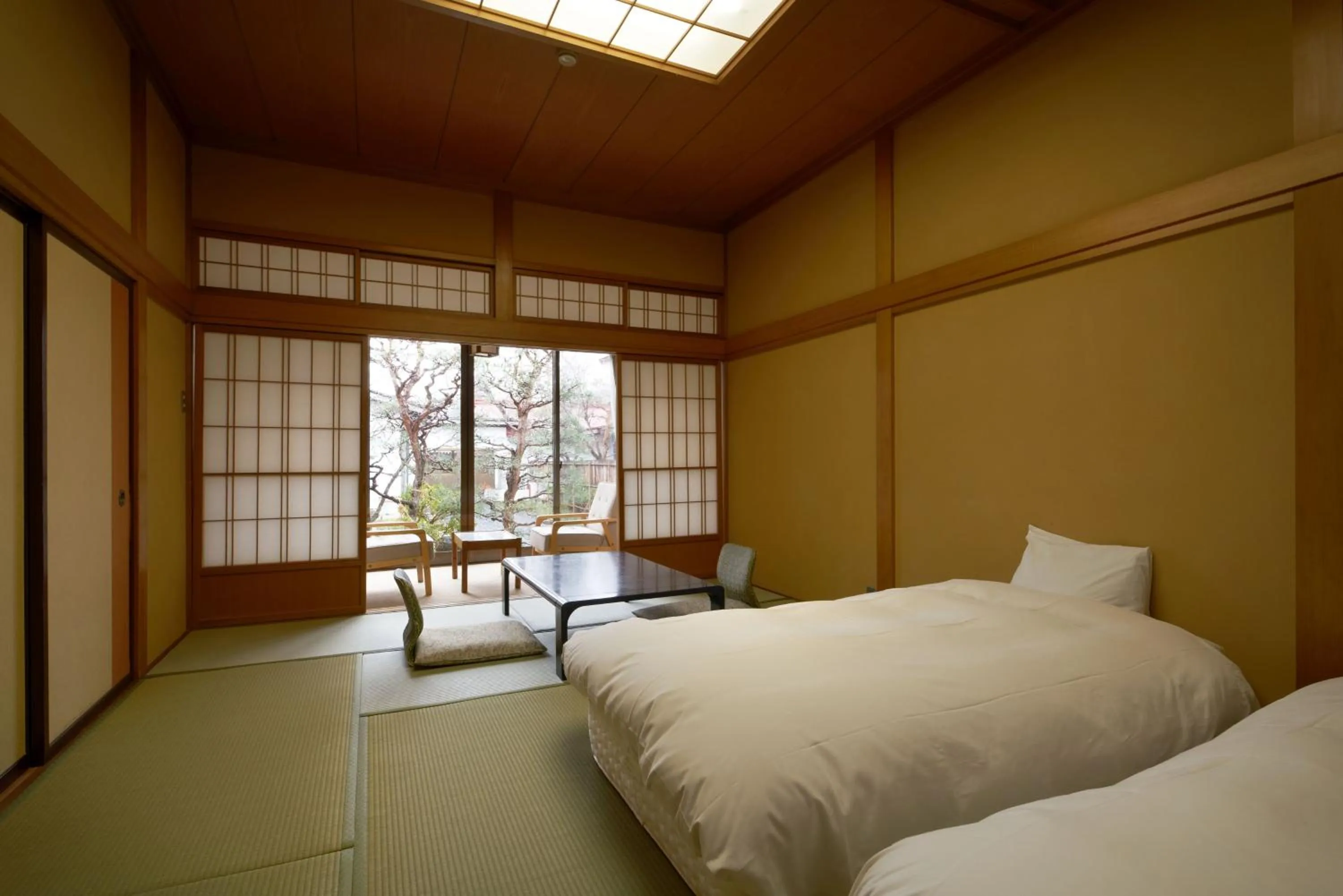 Bed in Takamiya Ryokan Sagiya Sansorai