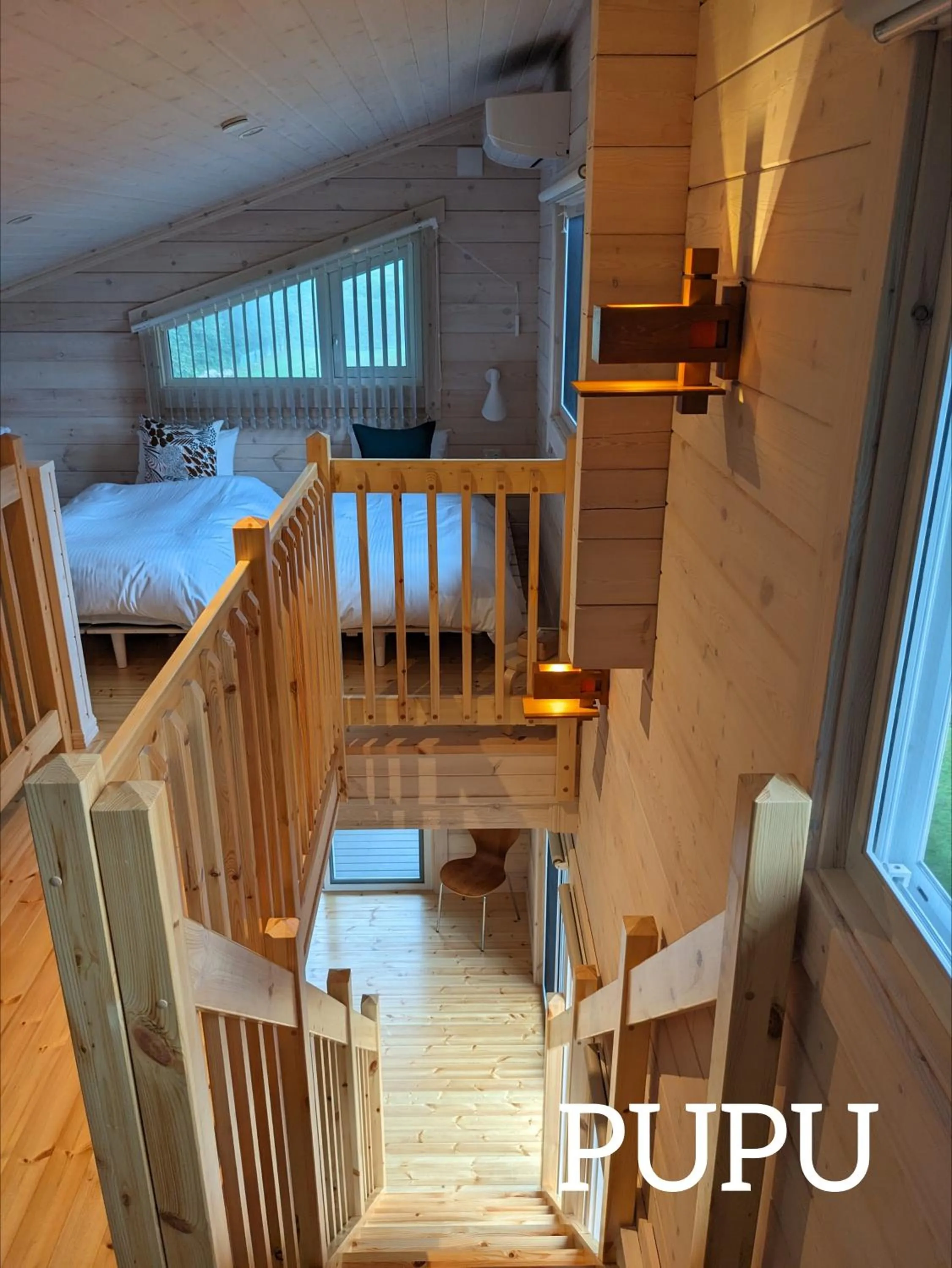 Bed in Log cabin rentals & Finland sauna Step House