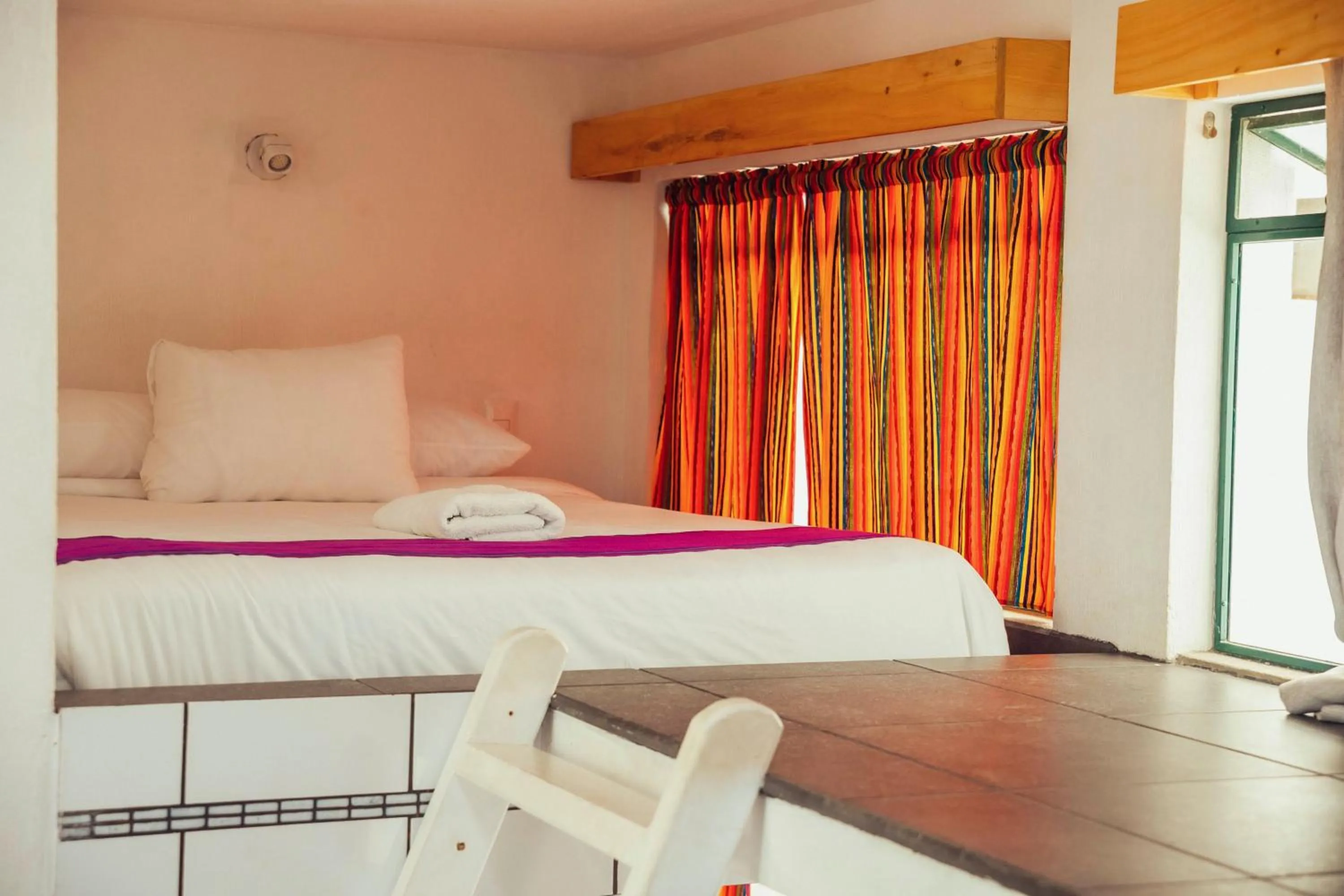 Bed in El Dragon Hotel