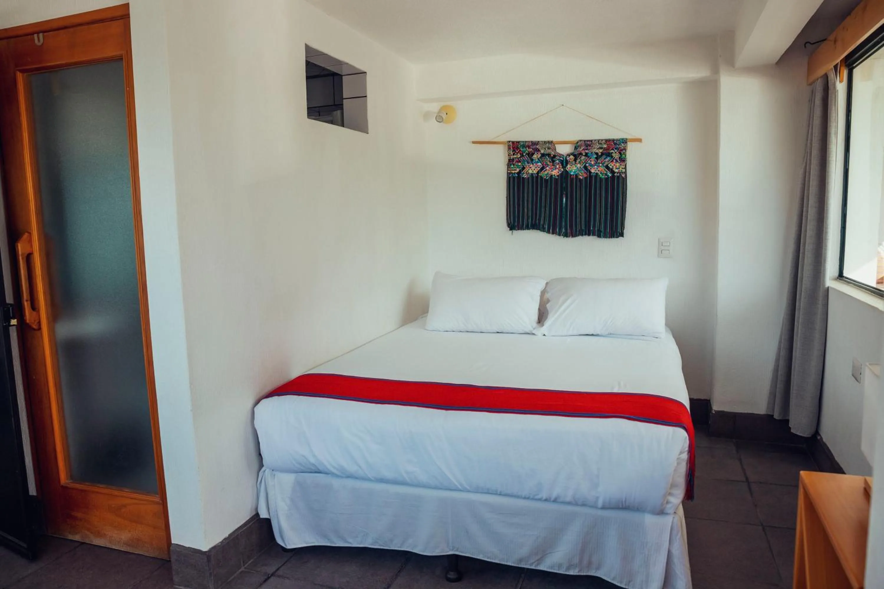 Bed in El Dragon Hotel