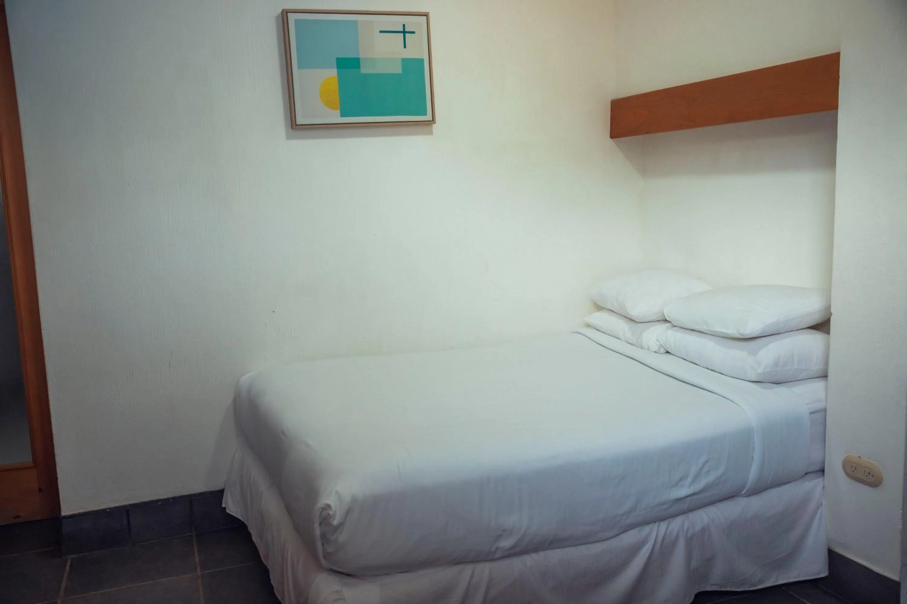 Bed in El Dragon Hotel