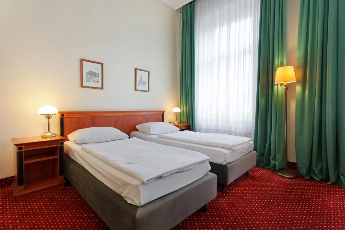 Bed in acom Hotel Berlin Kurfürstendamm