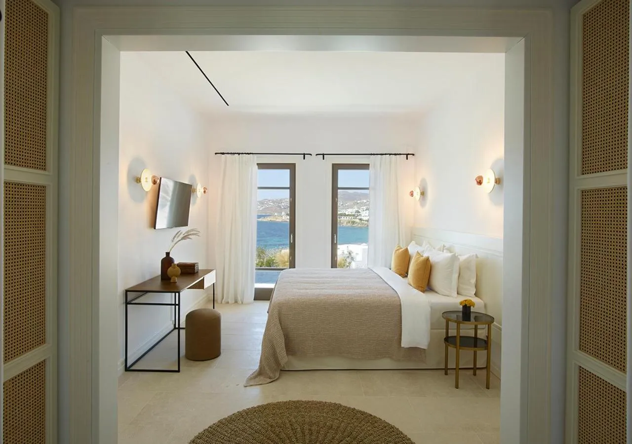 Bed in Bonzoe Suites & Villas